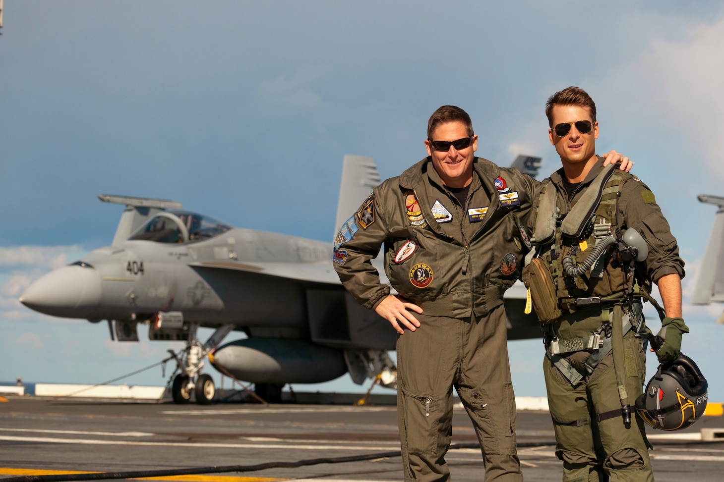 Navy Aerial Advisor Capt. Brian Ferguson and Glen Powell on the set of Top Gun: Maverick by Paramount Pictures, Skydance and Jerry Bruckheimer Films.