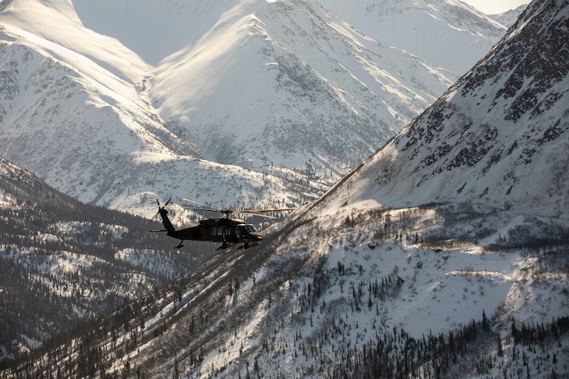 Alaska Army National Guardsmen with the 2-211th General Support Aviation Battalion travel from Joint Base Elmendorf-Richardson to Nome, Alaska, via UH-60L Black Hawk helicopter April 11, 2022. The UH-60L Black Hawk helicopters will remain in Nome for Golf Company, Detachment 1, 2-211th GSAB to conduct annual training and aide in River Watch if needed this spring. Should there be significant flooding or other emergency in the vicinity, the helicopters will provide support as requested by the State. (Alaska National Guard photo by 1st Lt. Balinda O’Neal)