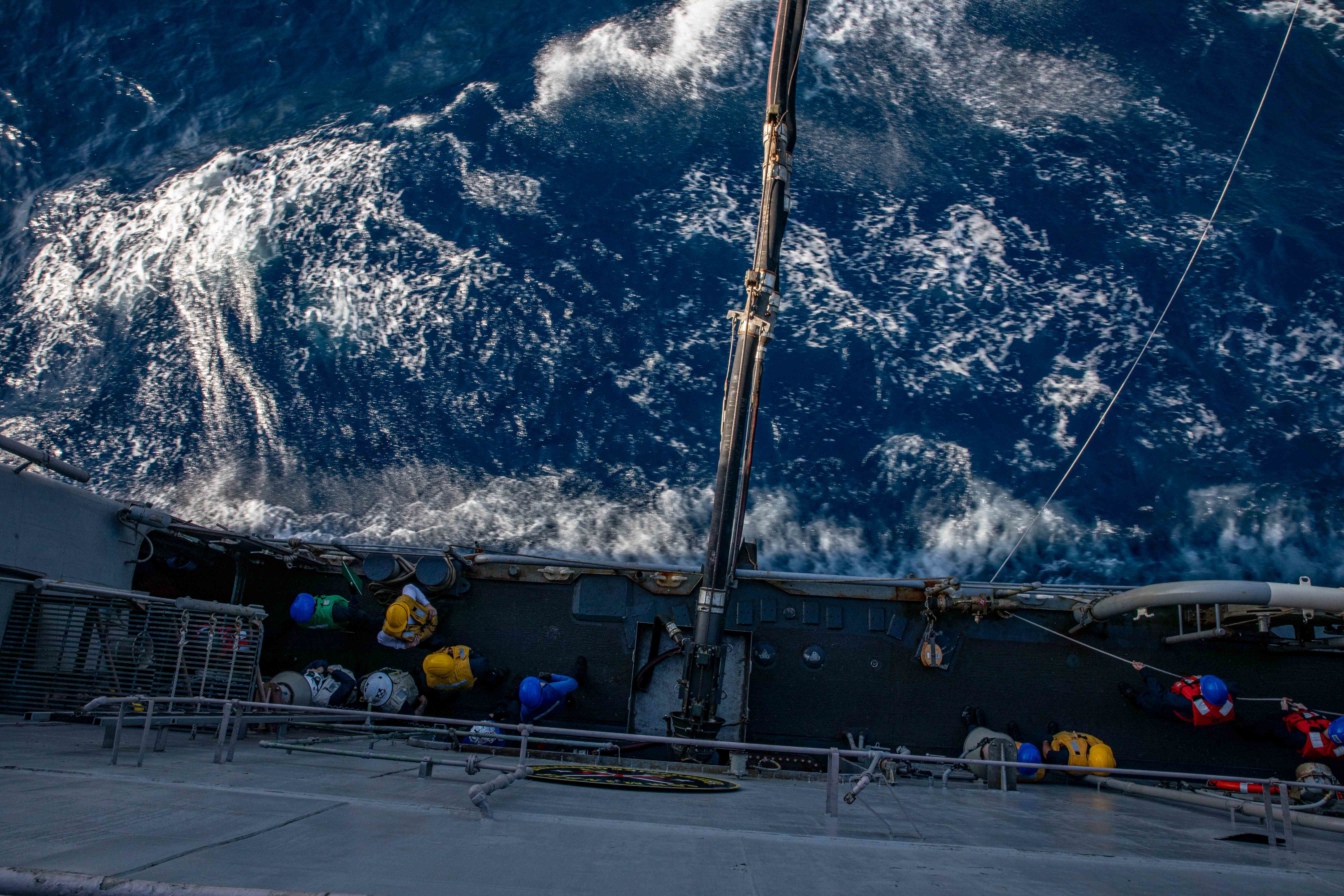 Sailors man a refueling station aboard Ticonderoga-class guided-missile cruiser USS San Jacinto (CG 56) during a replenishment-at-sea with the Military Sealift Command fleet combat supply ship USNS Supply (T-AO6), May 21, 2022.