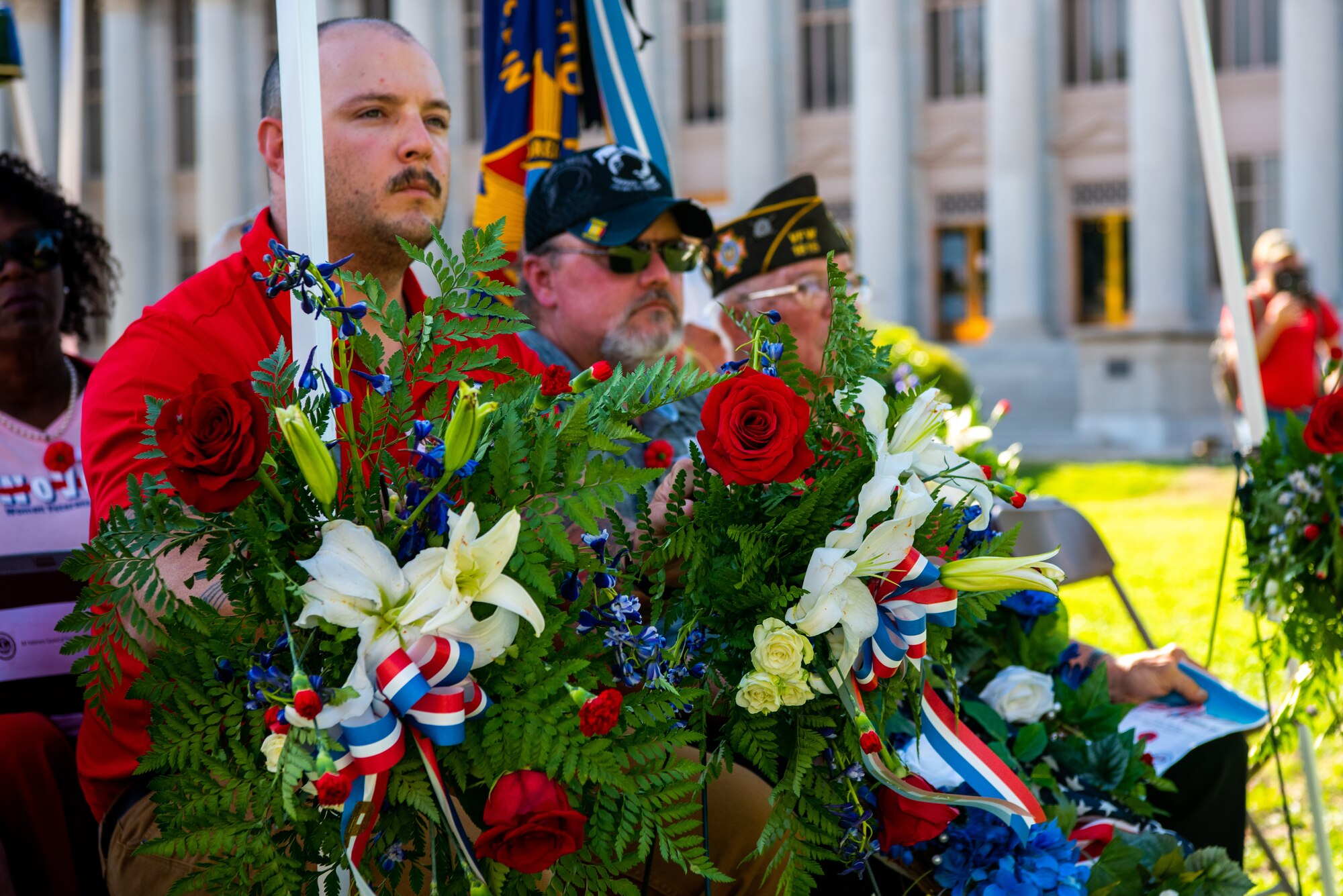 U.S. Air Force Tech. Sergeant Andrew Fruehan, 312th Training Squadron instructor, listens to a speech during a Memorial Day service  at the Tom Green County Courthouse Lawn, San Angelo, Texas, May 30, 2022. Members of Goodfellow Air Force Base and veterans of the San Angelo community came together to honor those that made the ultimate sacrifice. (U.S. Air Force photo by Senior Airman Michael Bowman)