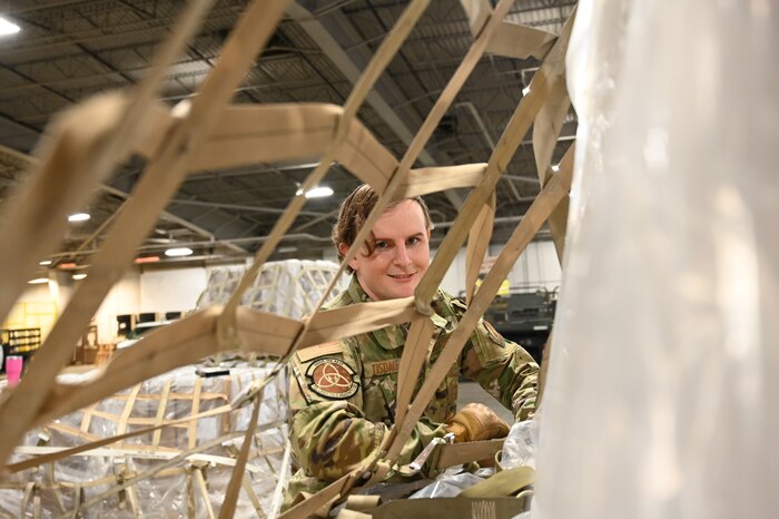 SSgt. Bryan Tisdale secures humanitarian package.