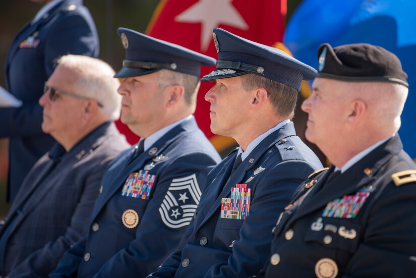 Leaders of Kentucky National Guard participate in a memorial service held in Frankfort, Ky., May 30, 2022, honoring members of the Kentucky Guard who have died in the line of duty. From left to right are Army Brig. Gen. Benjamin F. Adams III (retired), former assistant adjutant general for Army and chairman of the Kentucky National Guard Memorial Fund Inc.; Air Force Chief Master Sgt. James R. Tongate, state command chief; Air Force Brig. Gen. Jeffrey L. Wilkinson, assistant adjutant general for Air; and Army Maj. Gen. Haldane B. Lamberton, the adjutant general of the Commonwealth of Kentucky. (U.S. Air National Guard photo by Dale Greer)