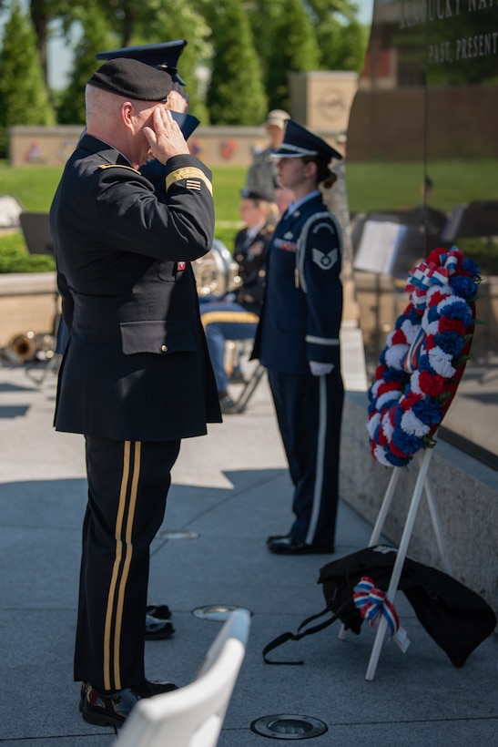 Army Maj. Gen. Haldane B. Lamberton, the adjutant general of the Commonwealth of Kentucky, salutes a wreath at the Kentucky National Guard Memorial during a ceremony in Frankfort, Ky., May 30, 2022. The memorial honors 286 Solders and Airmen from the Kentucky Guard who have paid the ultimate price for freedom since 1912. (U.S. Air National Guard photo by Dale Greer)