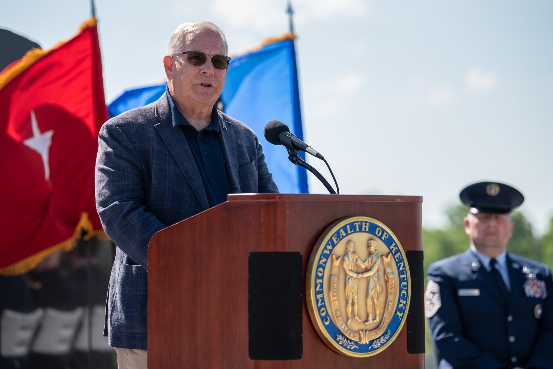 Army Brig. Gen. Benjamin F. Adams III (retired), former assistant adjutant general for Army and chairman of the Kentucky National Guard Memorial Fund Inc. reads the names of 13 fallen Soldiers who were added to the memorial this year during a ceremony at Boone National Guard Center in Frankfort, Ky., May 30, 2022. Of the 13 names being added, 11 were killed during World War I, one in 1935 during weekend training, and another in 2001 just prior to 9/11. The monument now honors 286 Solders and Airmen from the Kentucky Guard who have paid the ultimate price for freedom since 1912. (U.S. Air National Guard photo by Dale Greer)