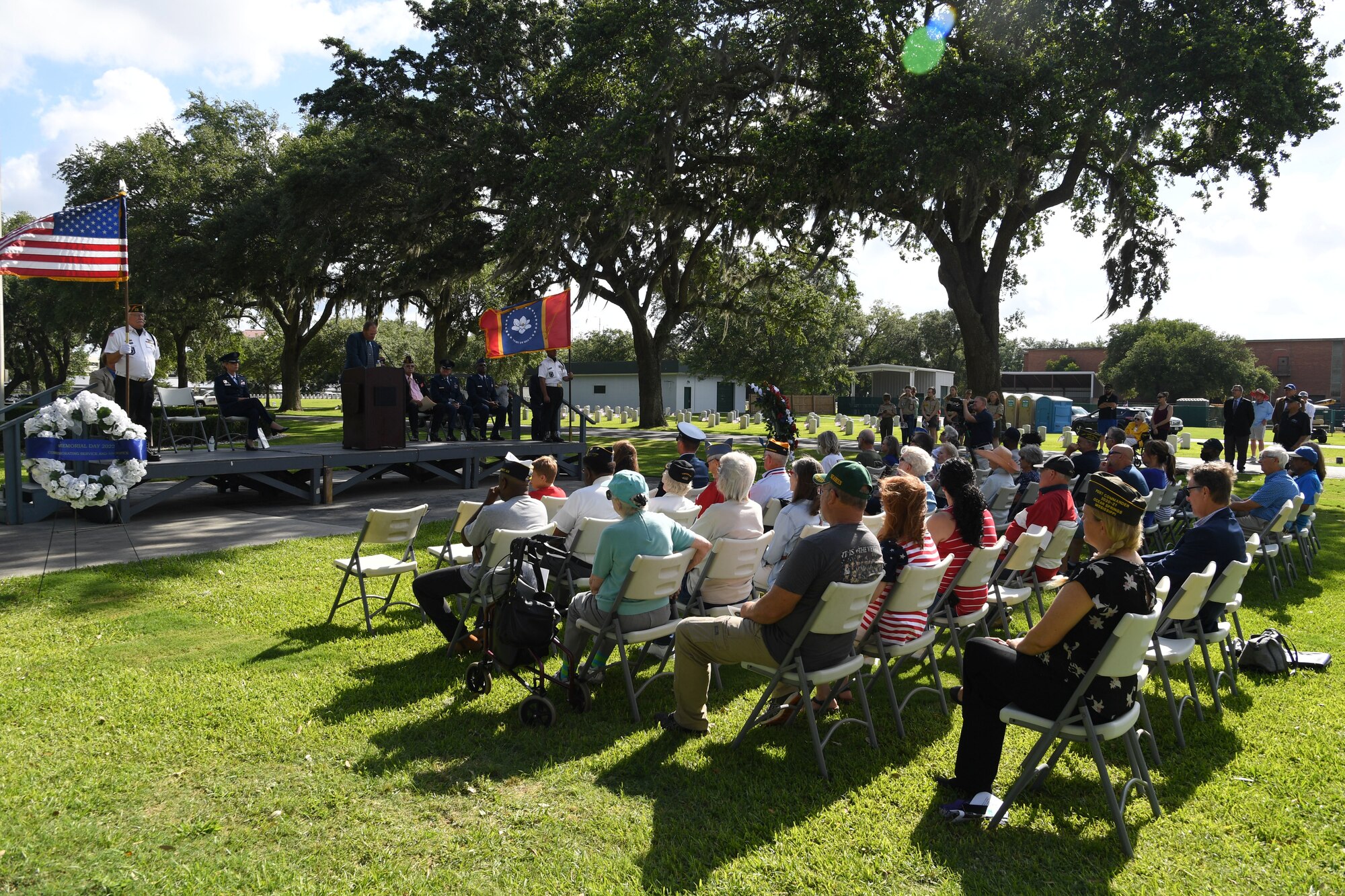 Local veterans and community members attend the Biloxi National Cemetery Memorial Day Ceremony in Biloxi, Mississippi, May 30, 2022. The ceremony honored those who have made the ultimate sacrifice while serving in the armed forces. Biloxi National Cemetery is the final resting place of more than 23,000 veterans and their family members. Every year, 800 burials take place there for men and women who served in wars years ago and for those defending America today. (U.S. Air Force photo by Kemberly Groue)