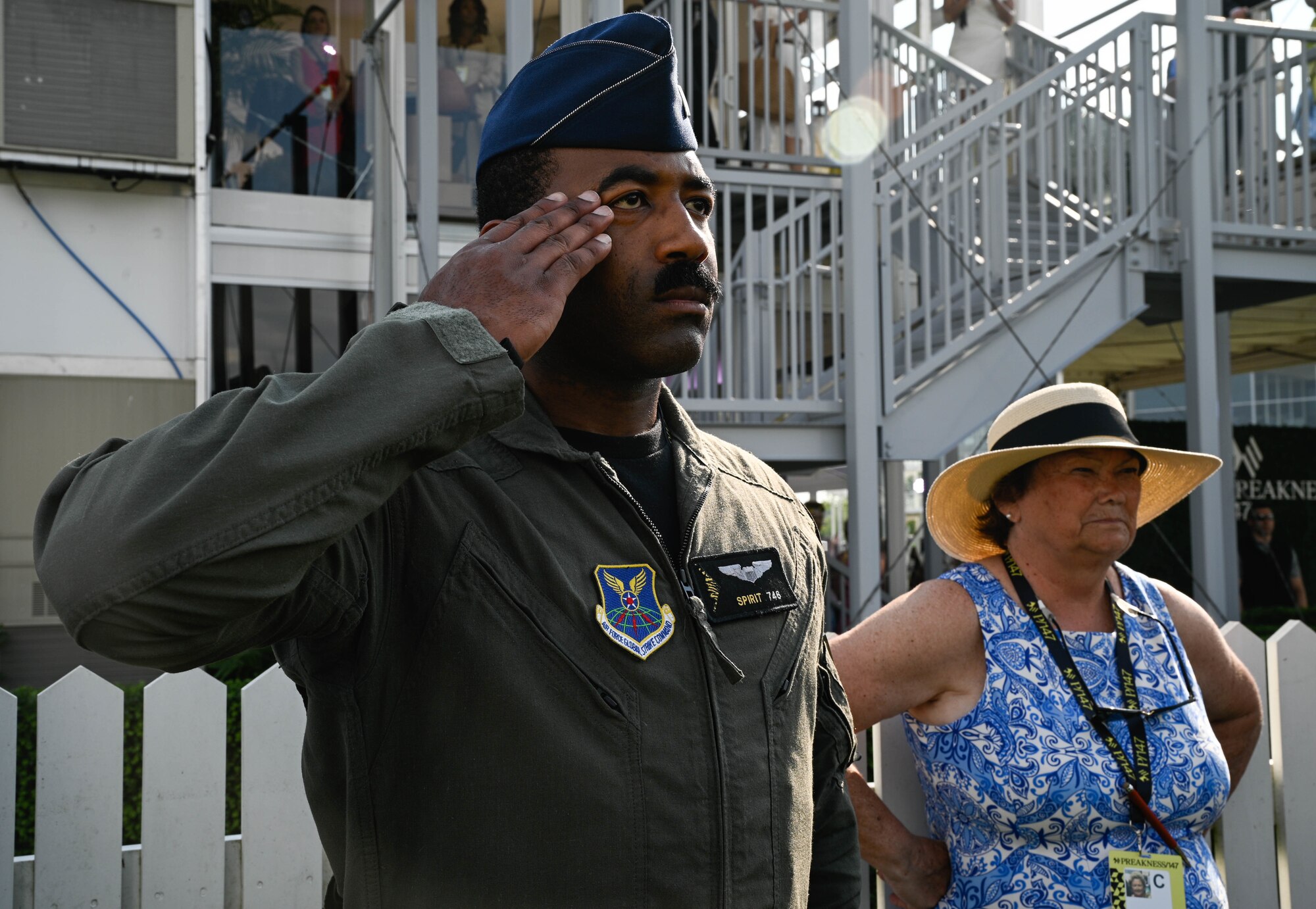 A U.S. Air Force B-2 Spirit pilot salutes during the National Anthem at the Pimlico race course, Baltimore, Maryland, May 21, 2022. The Preakness Stakes is an American thoroughbred horse race held on the third Saturday in May each year in Baltimore, Maryland.