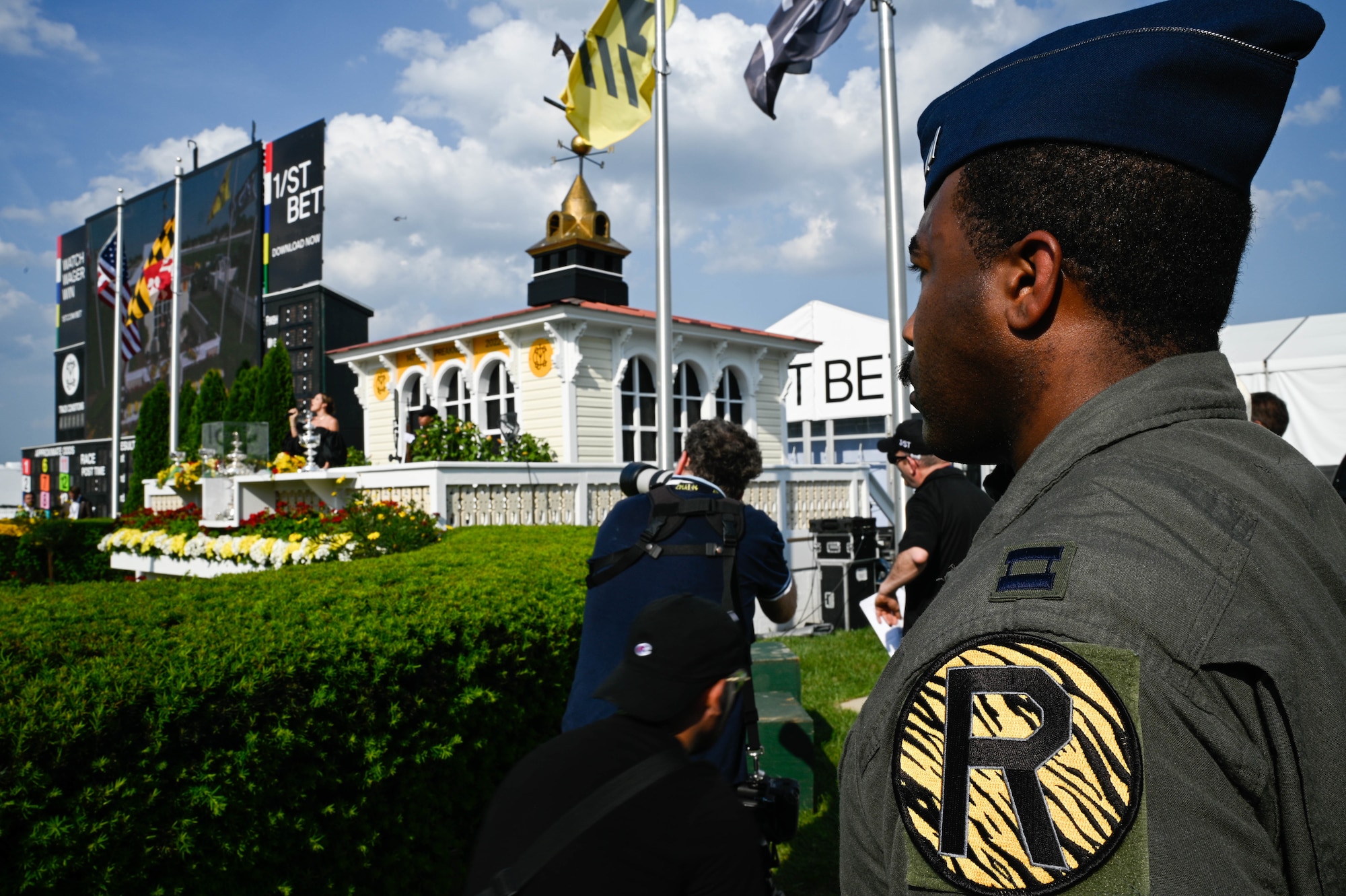 A U.S. Air Force B-2 Spirit pilot salutes during the National Anthem at the Pimlico race course, Baltimore, Maryland, May 21, 2022. The Preakness Stakes is an American thoroughbred horse race held on the third Saturday in May each year in Baltimore, Maryland.