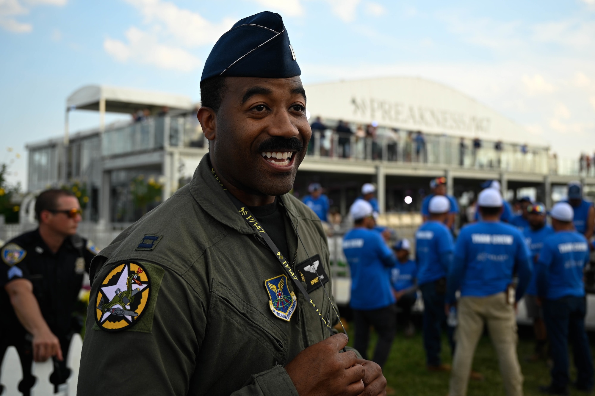 A U.S. Air Force B-2 Spirit pilot meets Preakness Stakes attendees at the Pimlico race course, Baltimore, Maryland, May 21, 2022. The Preakness Stakes is an American thoroughbred horse race held on the third Saturday in May each year in Baltimore, Maryland.