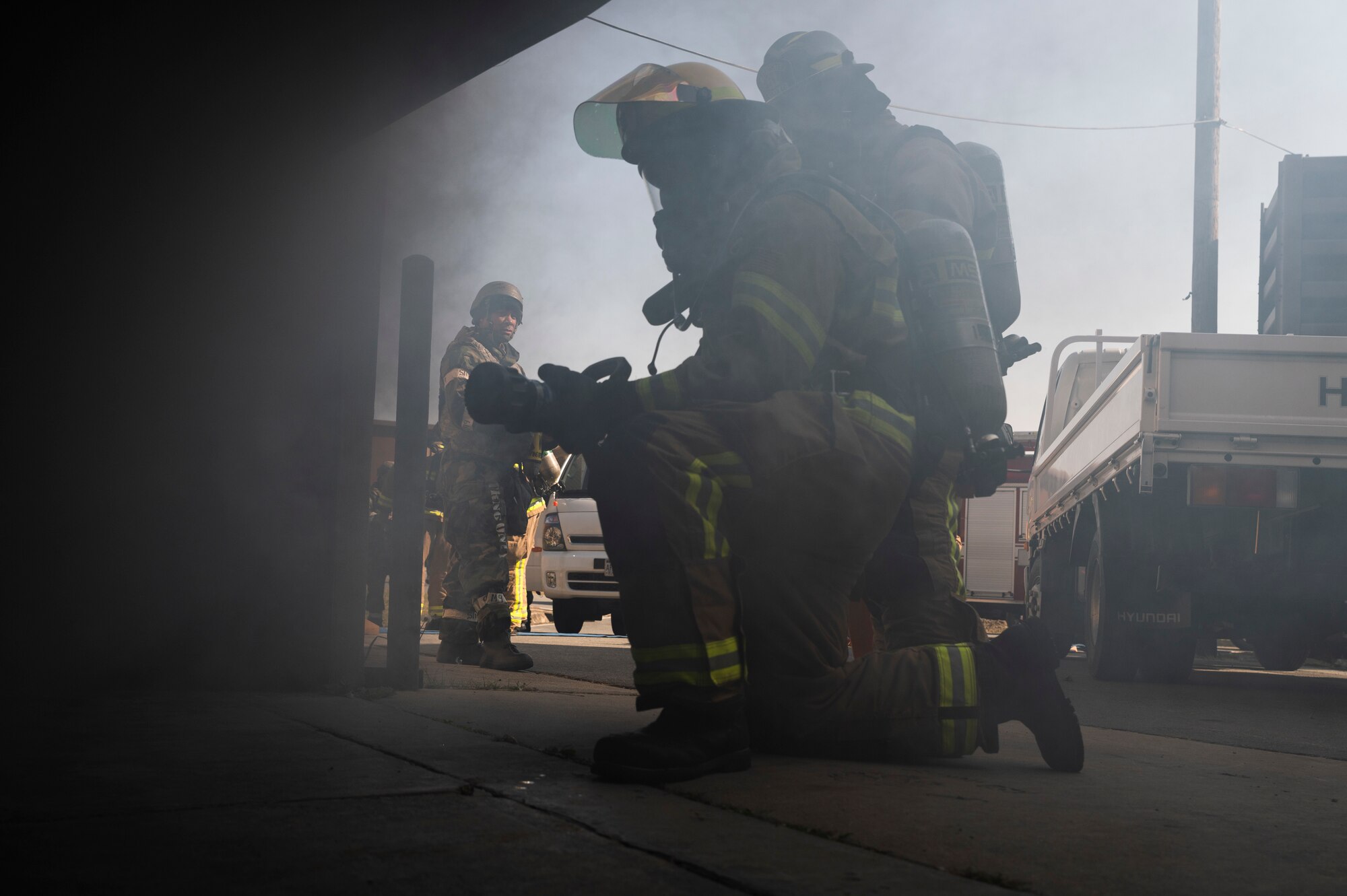 U.S. Air Force 51st Civil Engineer Squadron firemen simulate putting out a fire during a training event as part of Vigilant Storm 23 at Osan Air Base, Republic of Korea, Oct. 31, 2022.