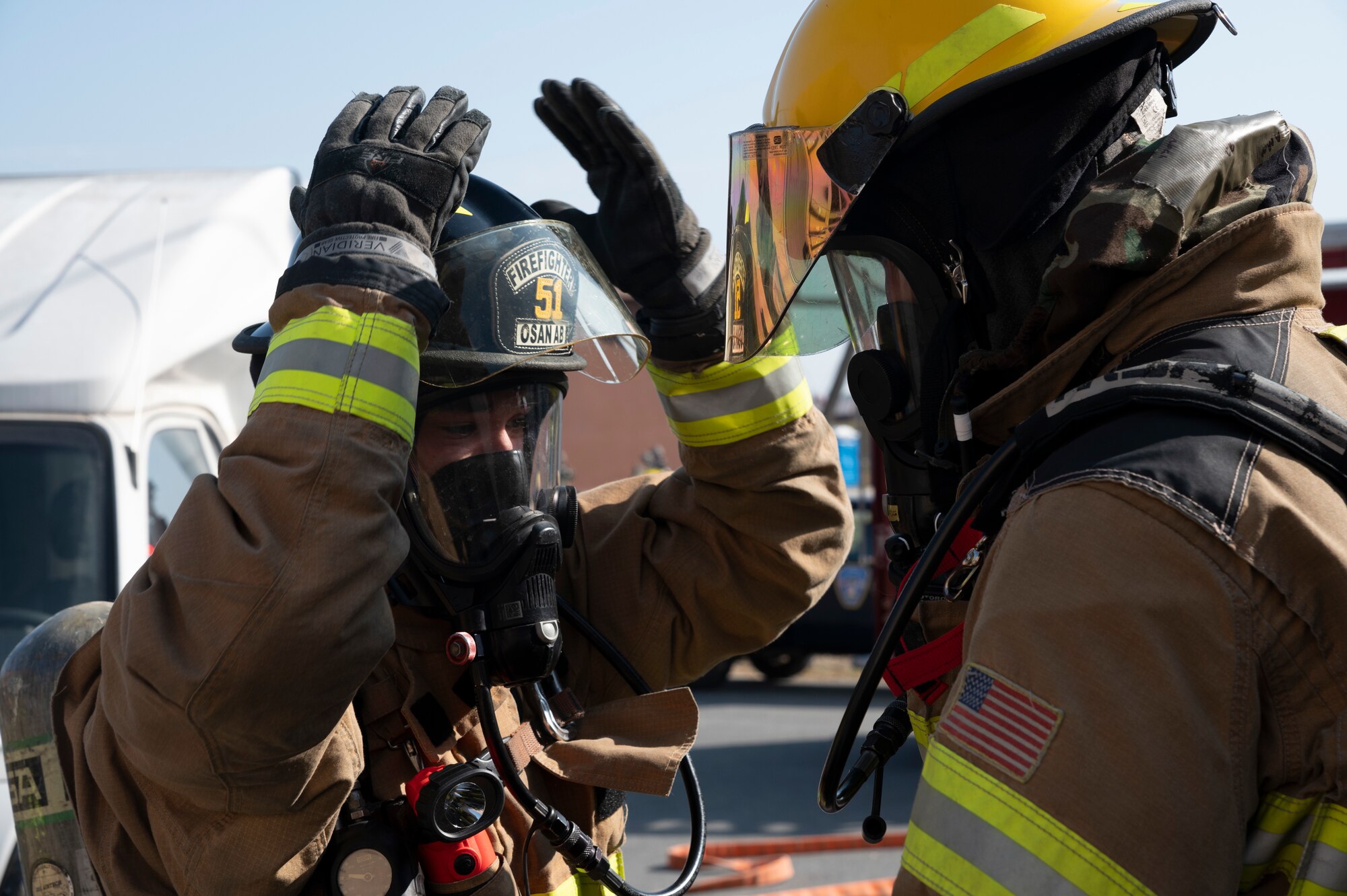 U.S. Air Force 51st Civil Engineer Squadron firemen evaluate their protective gear during a training event as part of Vigilant Storm 23 at Osan Air Base, Republic of Korea, Oct. 31, 2022.