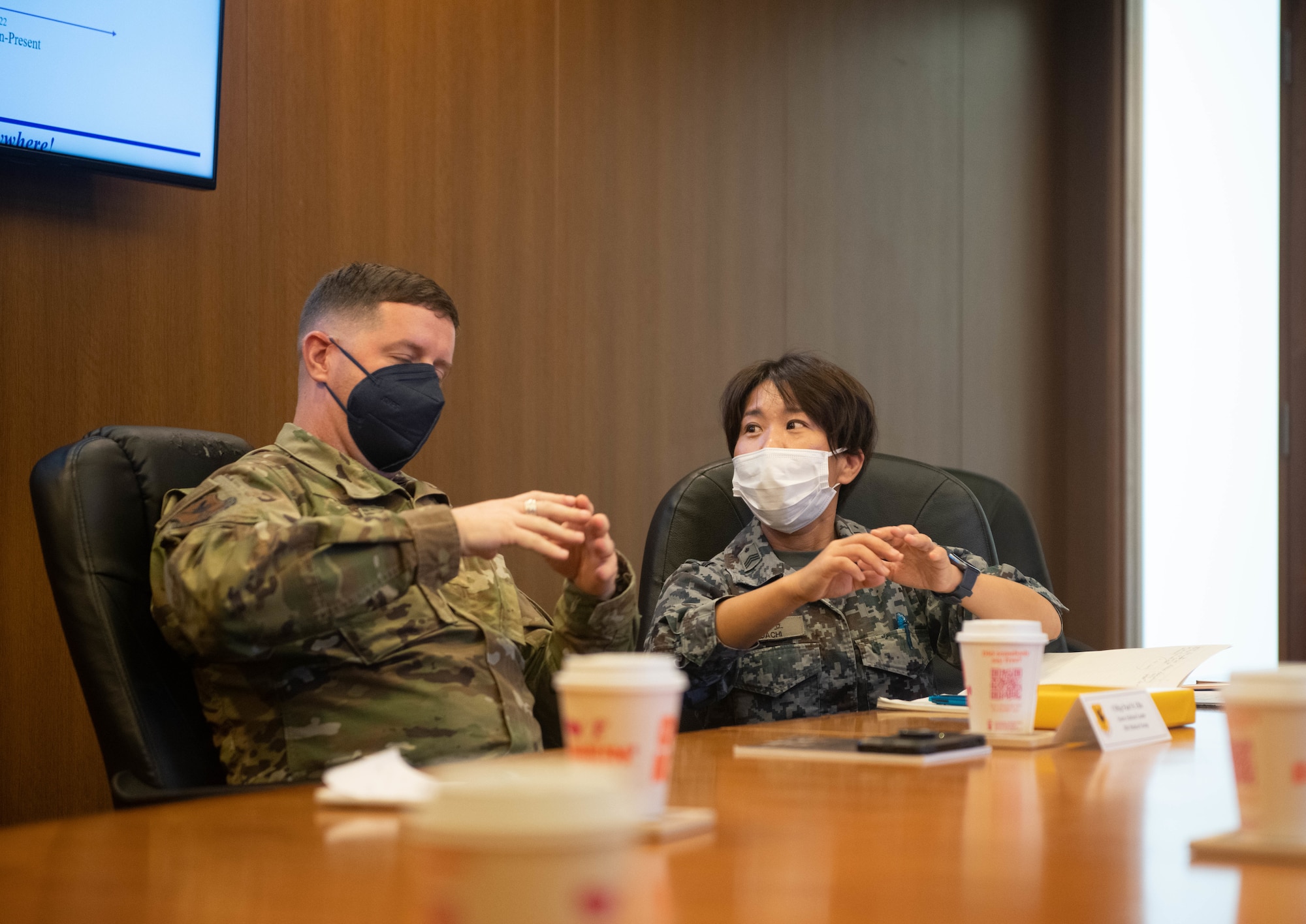 U.S. CMSgt speaks with JASDF medic.