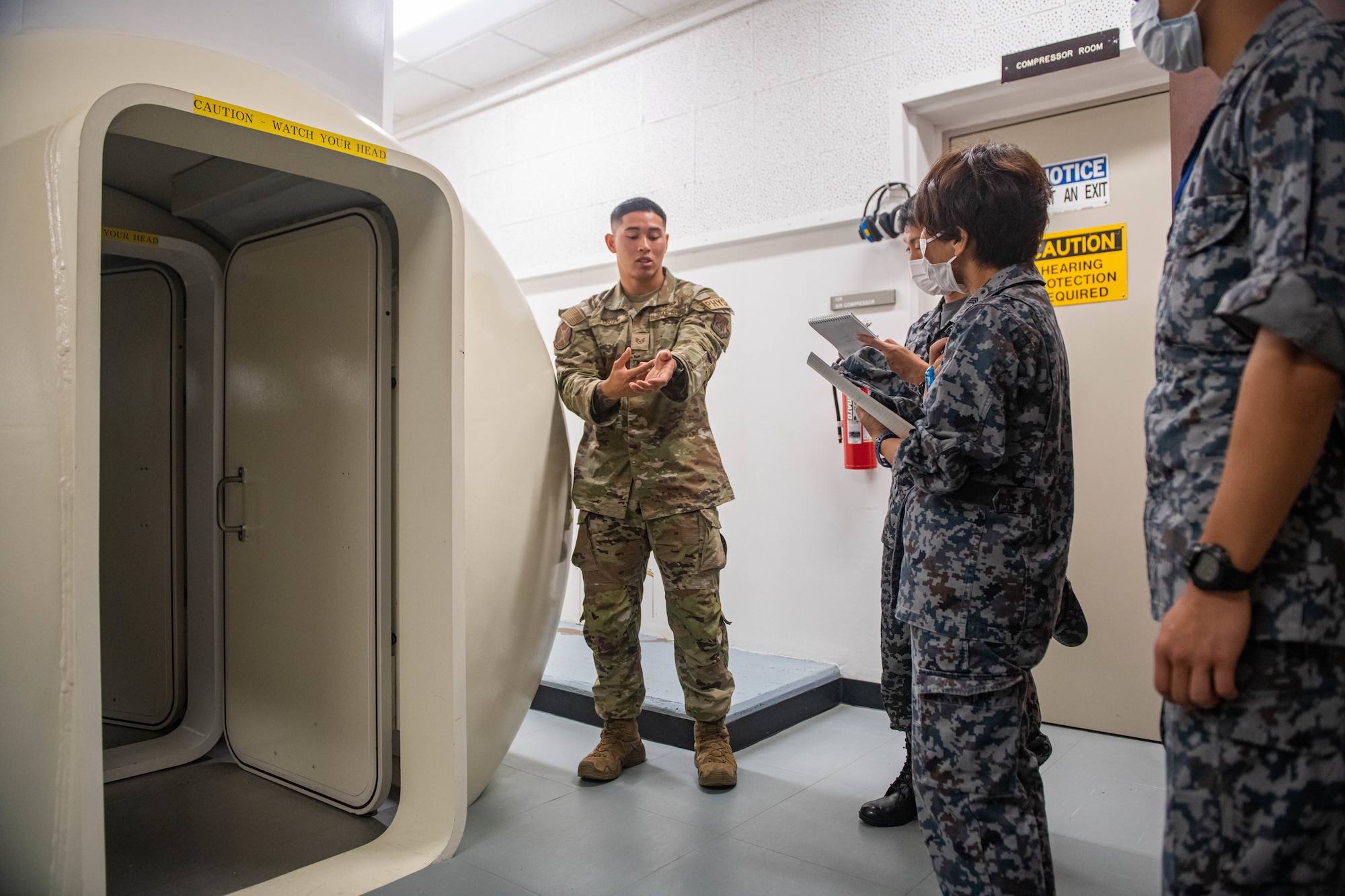 JASDF tours hyperbaric chamber.