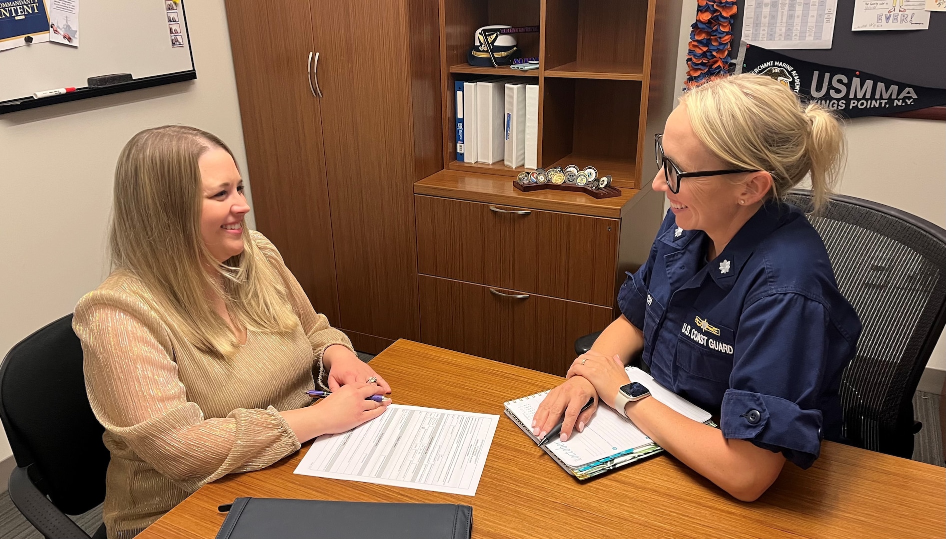 Cmdr. Krista Welch, Force Readiness Command (FORCECOM) - Training Mission Support Branch Chief, reviews the Individual Development Plan process and form with Leah Sibbitt, FORCECOM – Training Manager.