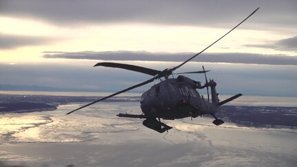 Members of the 210th and 211th Rescue Squadrons, Alaska National Guard, practice aerial refueling in an HH-60G Pave Hawk helicopter over Alaska Jan. 21, 2021. This practice helped prepare members of the unit to execute future rescue missions.