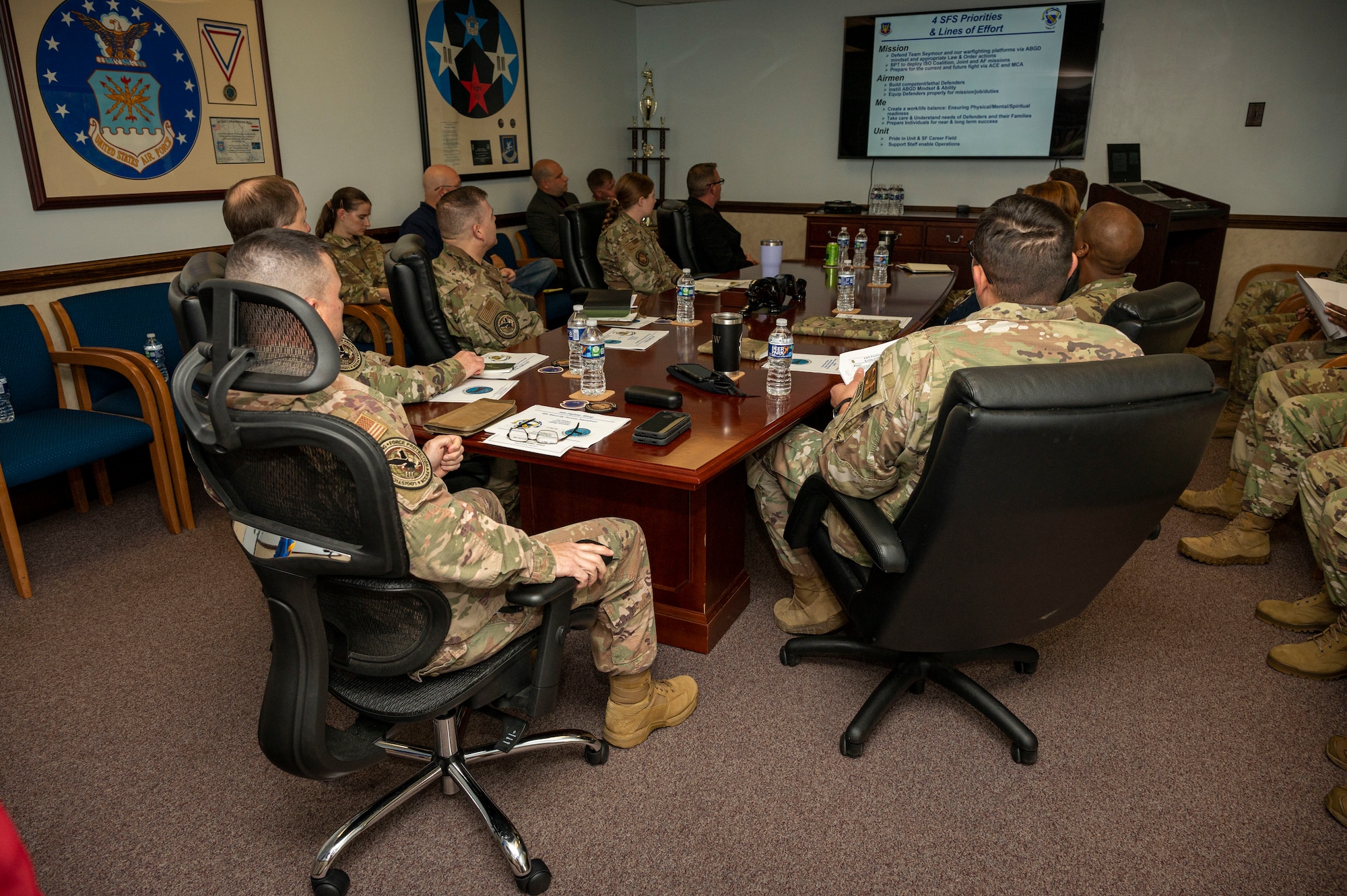 Airmen assigned to the 4th Security Forces Squadron and Air Combat Command hold a meeting on the 4th SFS missions and their goals at Seymour Johnson Air Force Base, North Carolina, Oct. 17, 2022. During the visit, ACC members met for a unit immersion to talk about new changes coming to the 4th SFS enterprise and ACC. (U.S. Air Force photo by Airman 1st Class Sabrina Fuller)