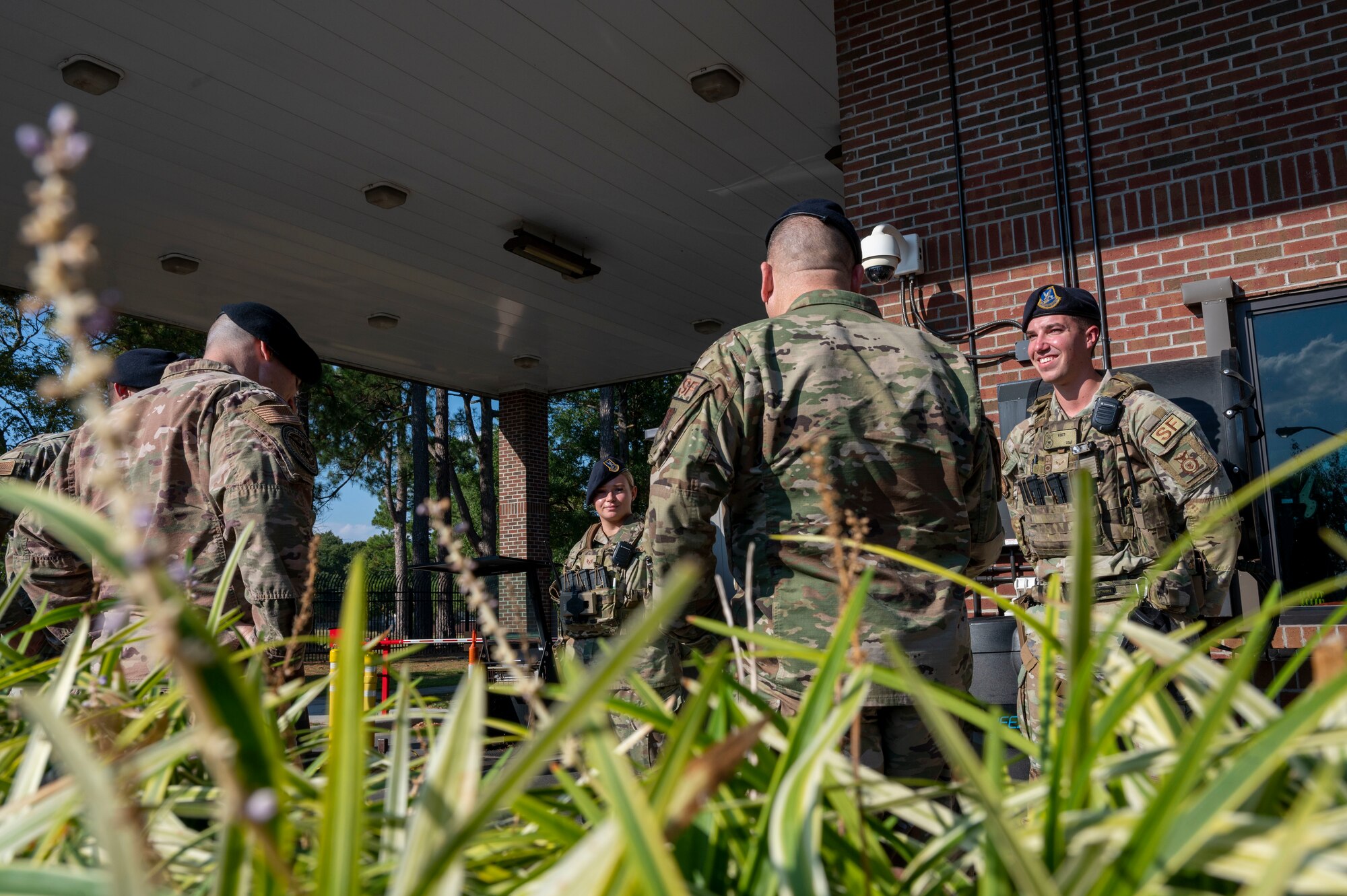 Airmen assigned to the 4th Security Forces Squadron and Air Combat Command meet with security forces members at Berkeley Gate at Seymour Johnson Air Force Base, North Carolina, Oct. 17, 2022. During the visit, ACC members met for a unit immersion to talk about new changes coming to the 4th SFS enterprise and ACC. (U.S. Air Force photo by Airman 1st Class Sabrina Fuller)