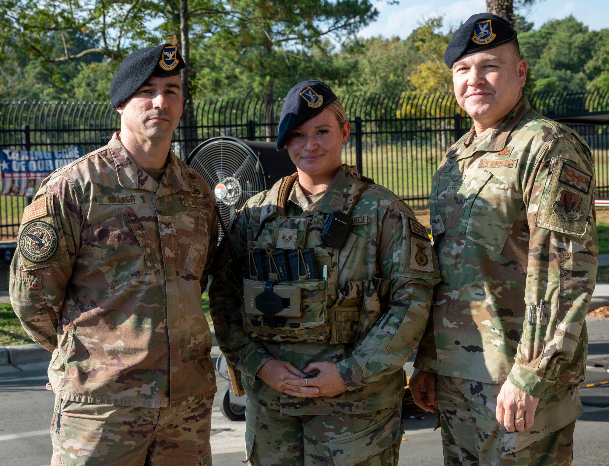 Staff Sgt. Erica Seison, 4th Security Forces Squadron desk sergeant receives recognition from Col. Kevin Walker, Air Combat Command chief of security forces and Chief Master Sgt. Steven Koehler, ACC command security forces manager at Seymour Johnson Air Force Base, North Carolina, Oct. 17, 2022. Multiple Airmen were recognized for outstanding wingmanship and work ethic at Seymour Johnson AFB. (U.S. Air Force photo by Airman 1st Class Sabrina Fuller)