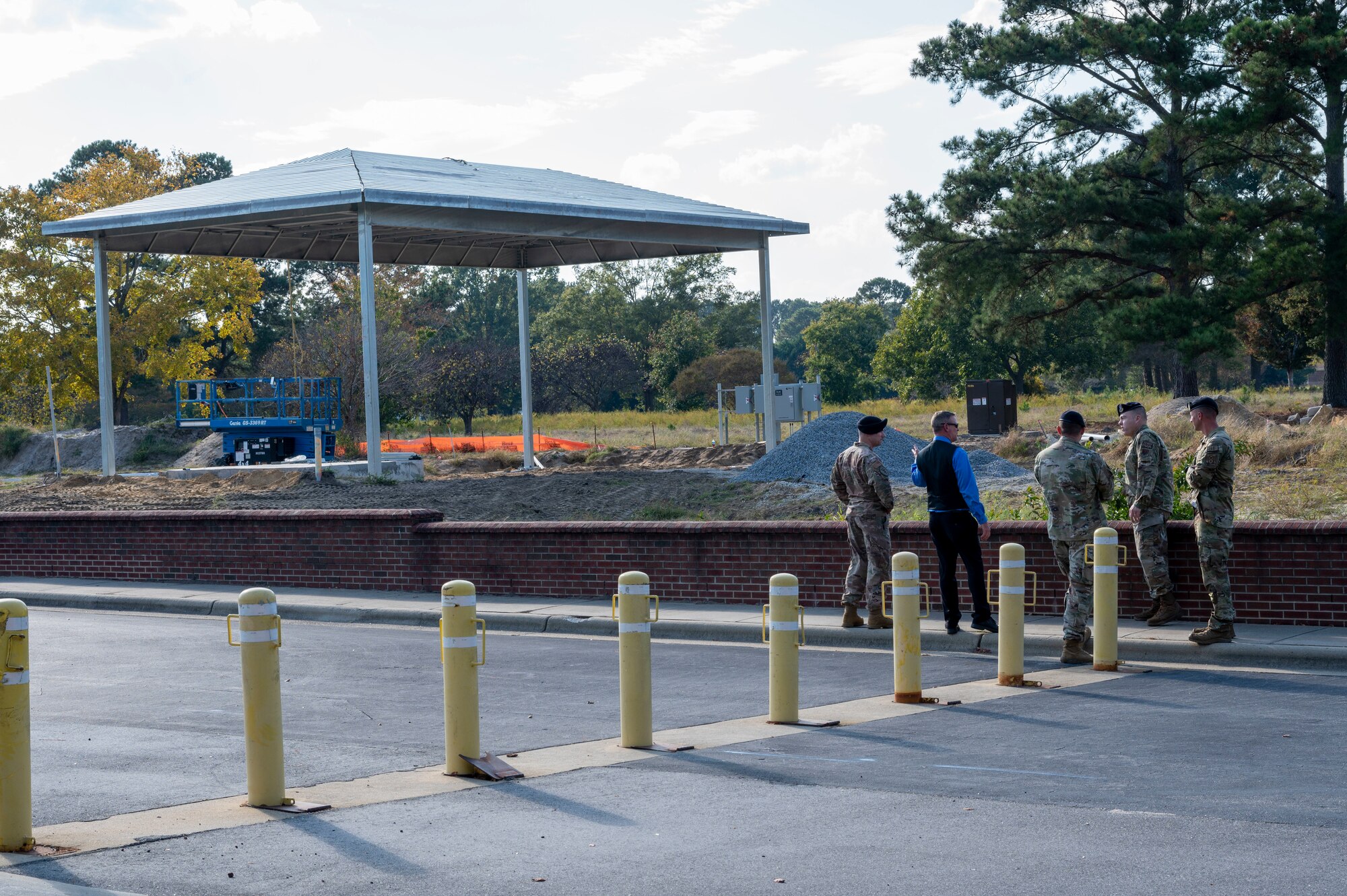 Airmen assigned to the 4th Security Forces Squadron and Air Combat Command observe construction at Berkeley Gate at Seymour Johnson Air Force Base, North Carolina, Oct. 17, 2022. The Berkeley Gate is under construction to allow for another entry control point to include a roundabout for easier base access and to safeguard base assets. (U.S. Air Force photo by Airman 1st Class Sabrina Fuller)