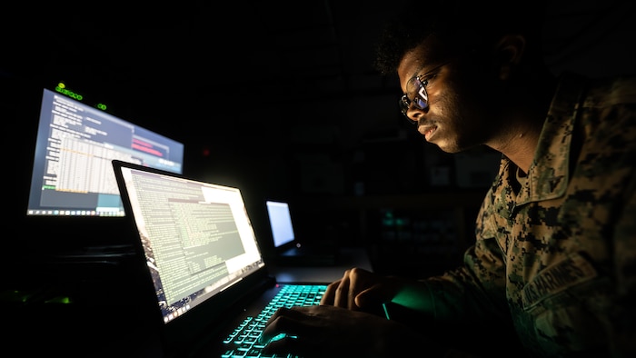 U.S. Marine Corps Lance Cpl. Ram Francis, a data systems administrator with Headquarters Battalion, 23rd Marine Regiment, monitors network traffic and activity on Fort Pickett, Virginia, Feb. 6, 2022. Marine Corps Systems Command recently launched the Technical Management and Analysis Directorate – or TMAD – in a drive to modernize the Marine Corps Enterprise Network, or MCEN. The Marine Corps Enterprise Network, or MCEN, is an interconnected “network of networks” that links service personnel, architecture, processes, physical and logical topology, and cyber operations.  (U.S. Marine Corps photo by Cpl. James Stanfield)