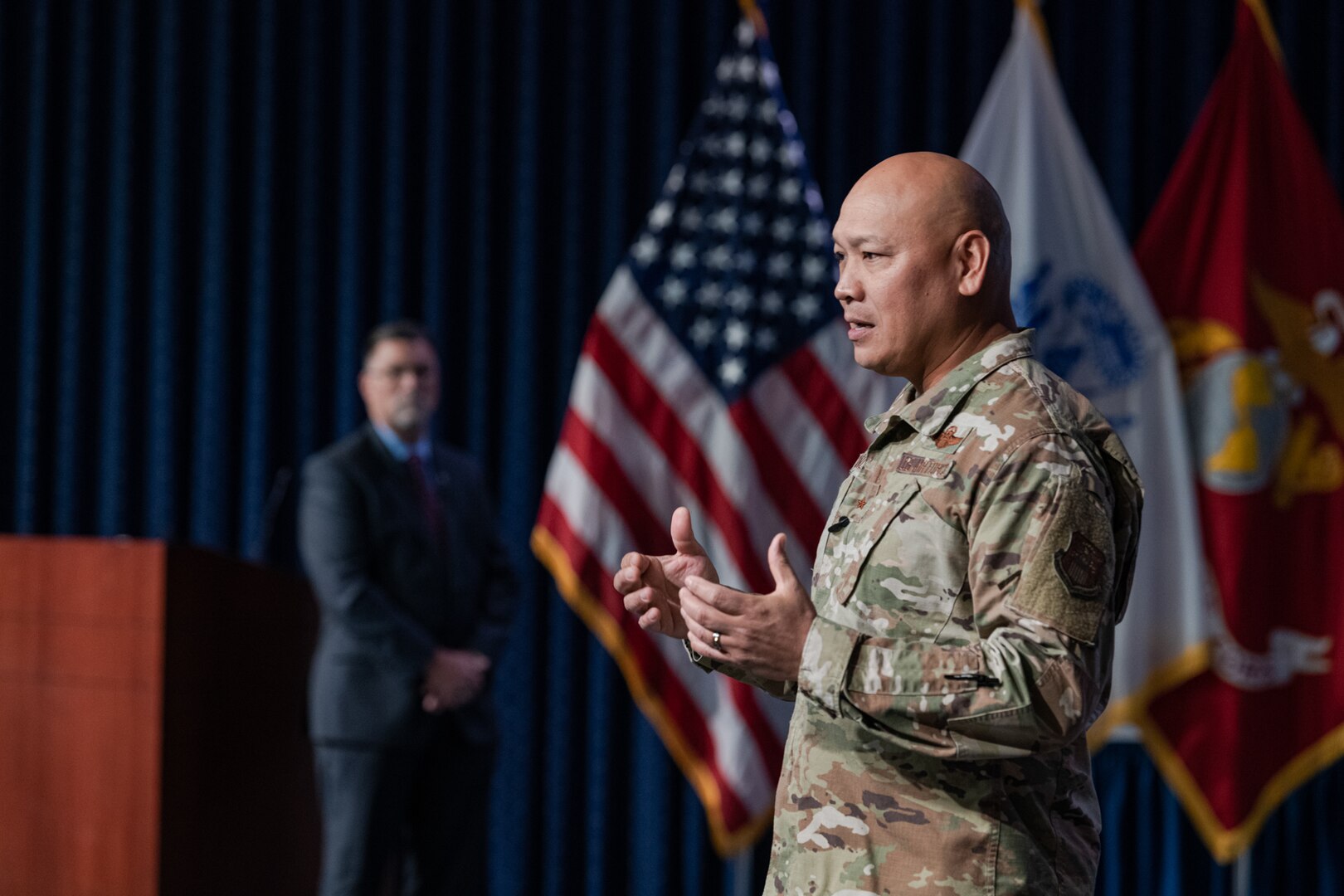 DLA Energy Commander Air Force Brig. Gen. Jimmy Canlas and DLA Energy Deputy Commander David Kless on stage