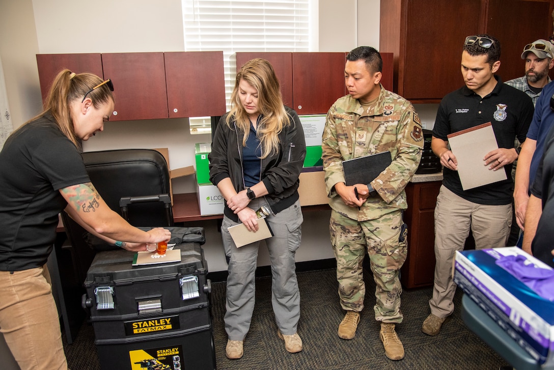 Special Agent Leslie Smith, a forensic science consultant, explains procedures to attendees at a training session on crime scene response, documentation, and handling of evidence at Joint Base San Antonio-Fort Sam Houston, Texas, Oct 21, 2022. (U.S. Air Force photo by Kara Carrier)