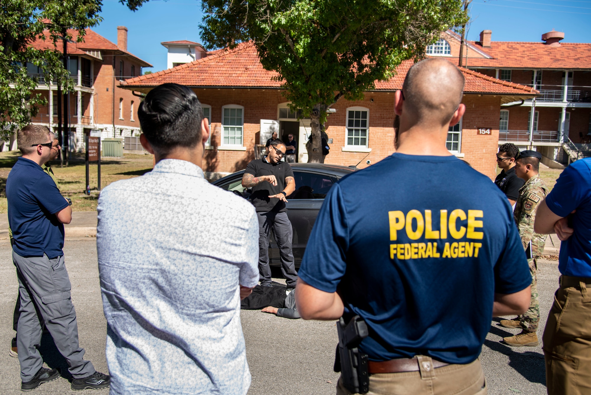 Special Agent Jeff Polanco, forensic science consultant, shows attendees at training Oct. 21, 2022, how to look at every aspect of a scene for investigation purposes at Joint Base San Antonio-Fort Sam Houston, Texas. (U.S. Air Force photo by Kara Carrier)