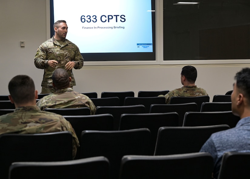 Finance airman giving briefing