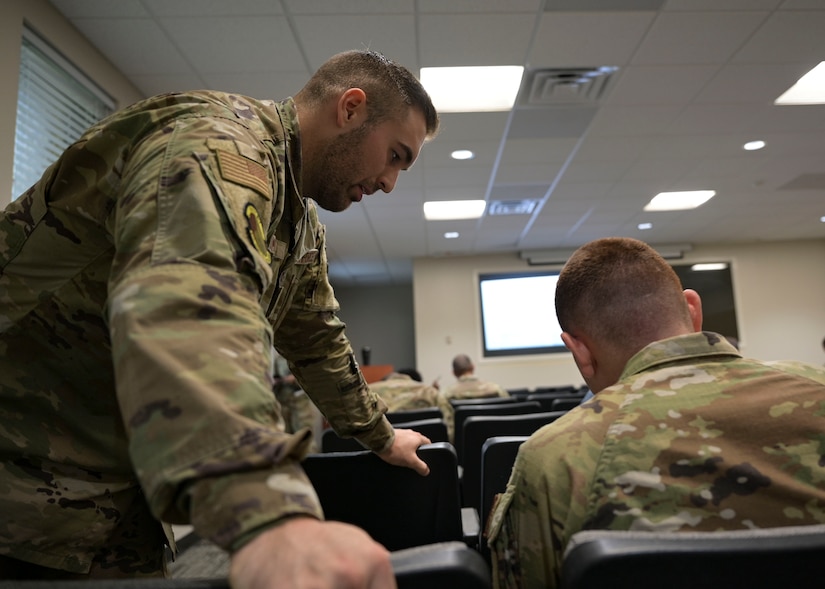 Airman assisting another person with questions.