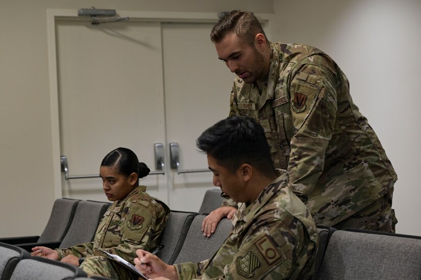 Airman assisting another person with questions.