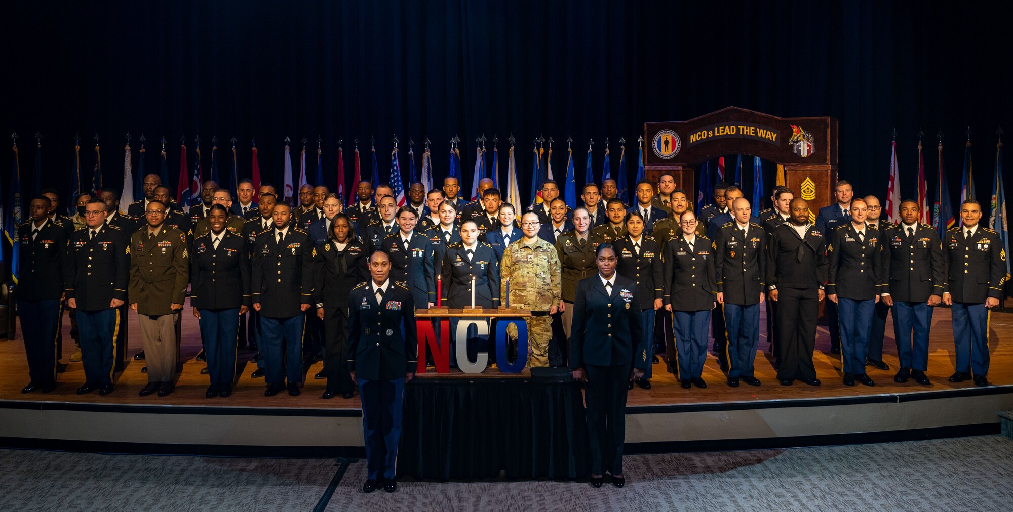 Service members pose for a group photo