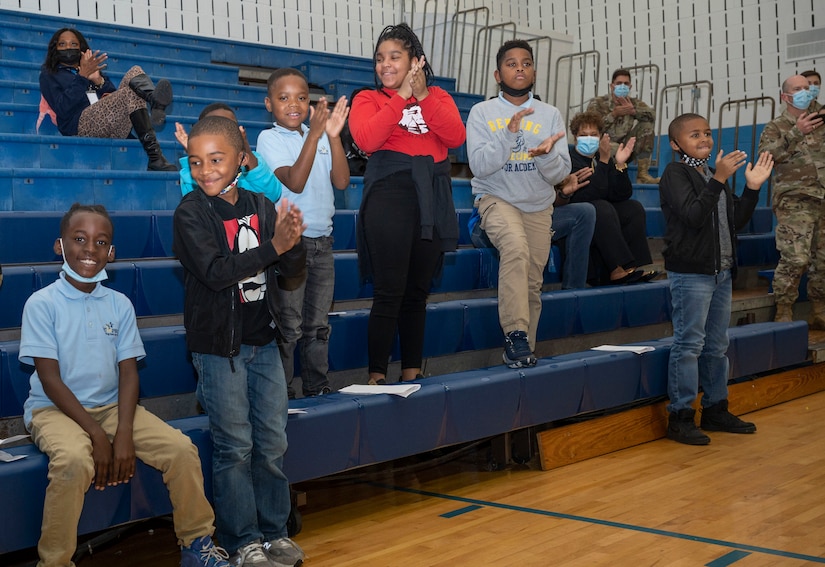 Members of Boys & Girls Clubs of Greater Washington applaud a performance by the U.S. Air Force Honor Guard Drill Team Oct. 25, 2022, Washington, D.C. This was the Honor Guard Drill Team’s first engagement event with BGCGW since the 11th Wing moved back to Joint Base Anacostia-Bolling in 2020. (U.S. Air Force photo by Jason Treffry)