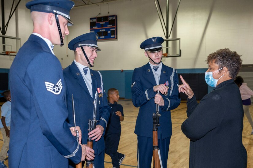 Boys & Girls Clubs of Greater Washington president & CEO Gabrielle Webster talks with members of the U.S. Air Force Honor Guard Drill Team after a performance for Boys & Girls Clubs of Greater Washington Oct. 25, 2022, Washington, D.C. Webster is the Honorary Commander assigned to the U.S. Air Force Honor Guard. Joint Base Anacostia-Bolling’s Honorary Commander program helps strengthen the relationship between service members and the communities of the National Capital Region. (U.S. Air Force photo by Jason Treffry)