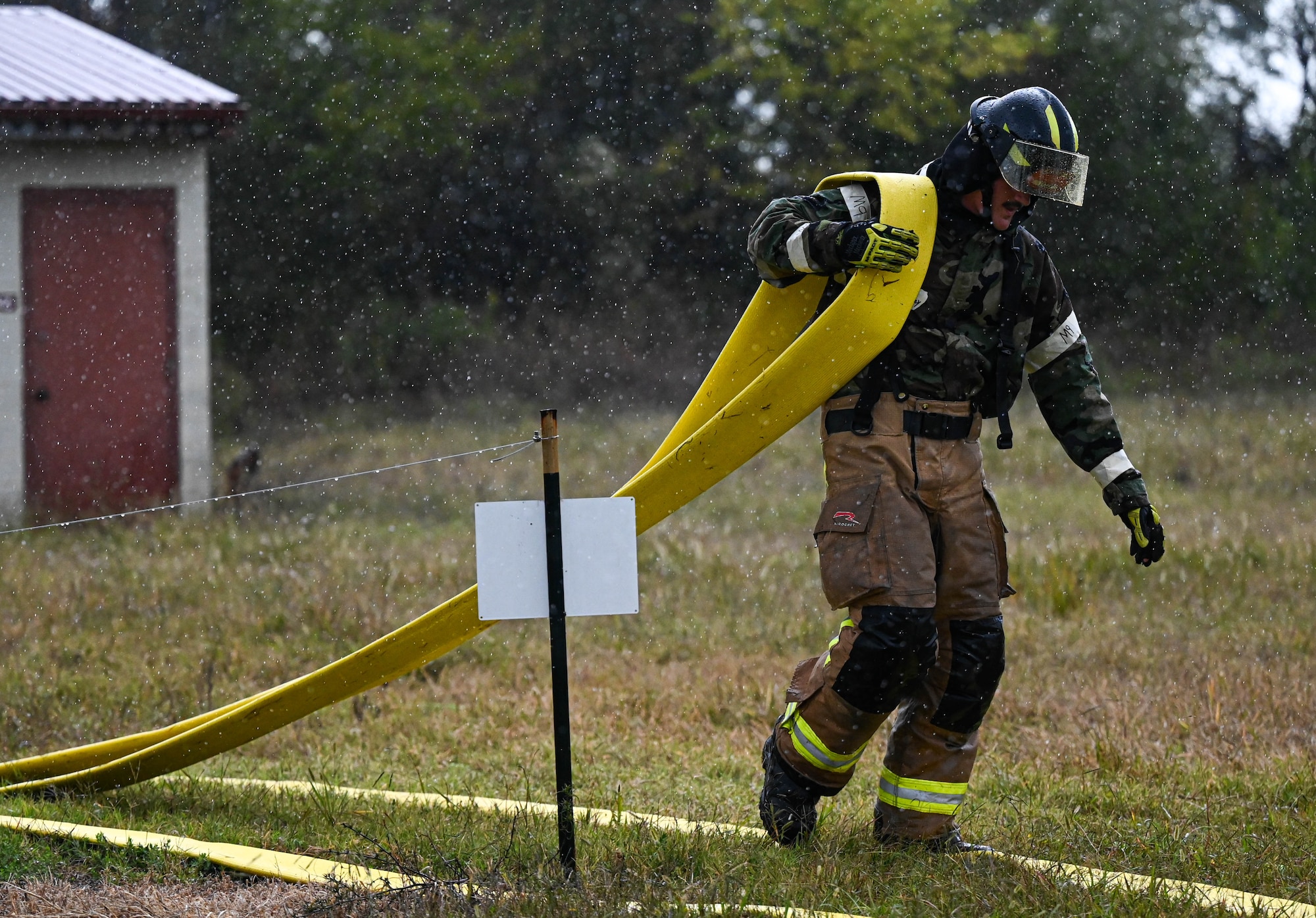 firefighters train through a base-wide CBRN exercise
