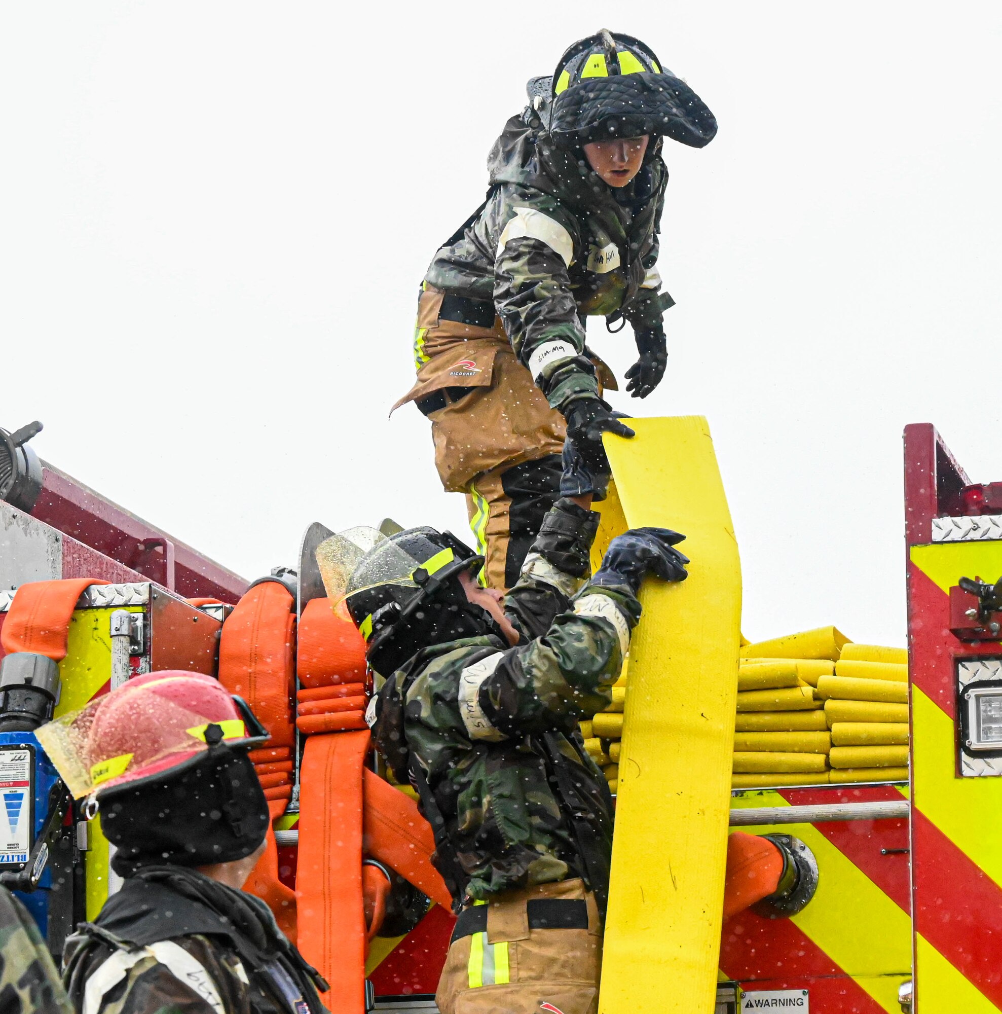 firefighters train through a base-wide CBRN exercise