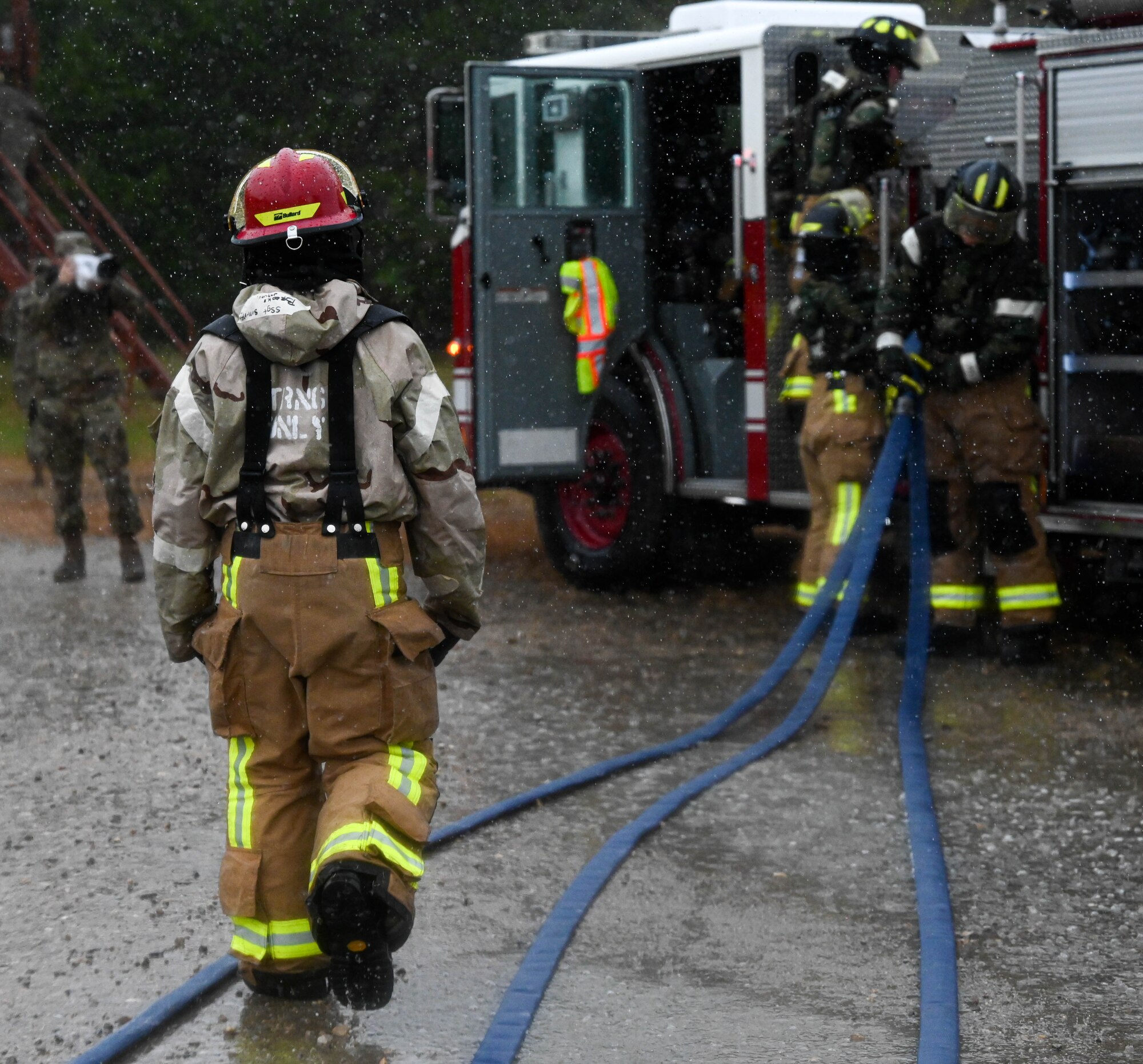 firefighters train through a base-wide CBRN exercise