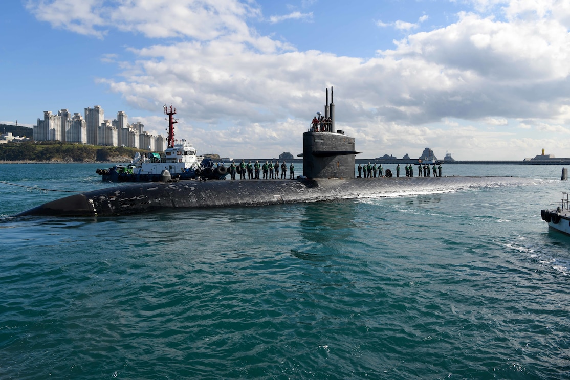 ugboats assist the Los Angeles-class fast-attack submarine USS Key West (SSN 722) as it prepares to moor in Busan, South Korea, Oct. 31, 2022.