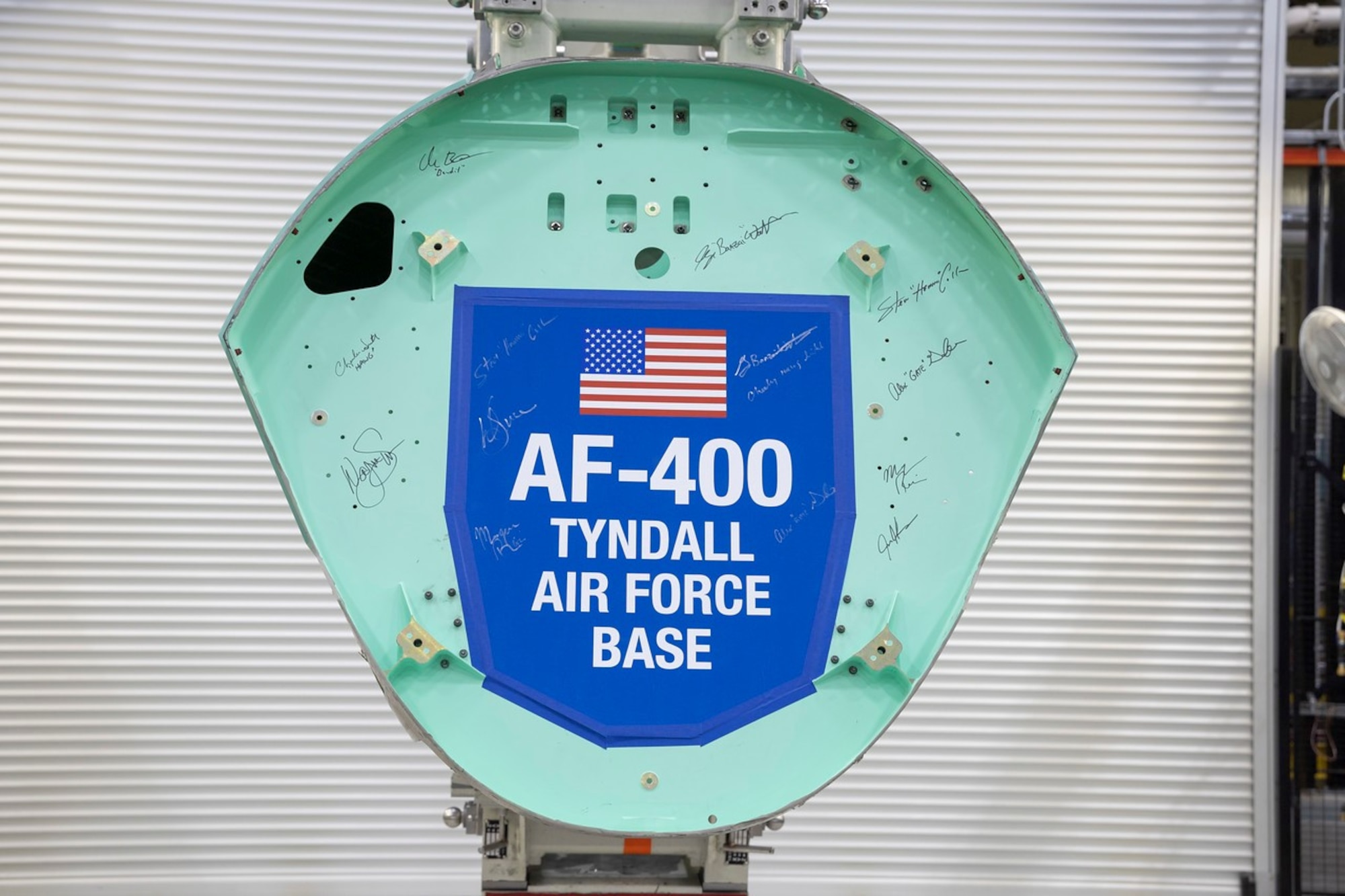 An F-35A Lightning II airframe structural component holds signatures of Airmen assigned to Tyndall Air Force Base, Florida, at the Lockheed Martin factory in Fort Worth, Texas, Oct. 20, 2022.