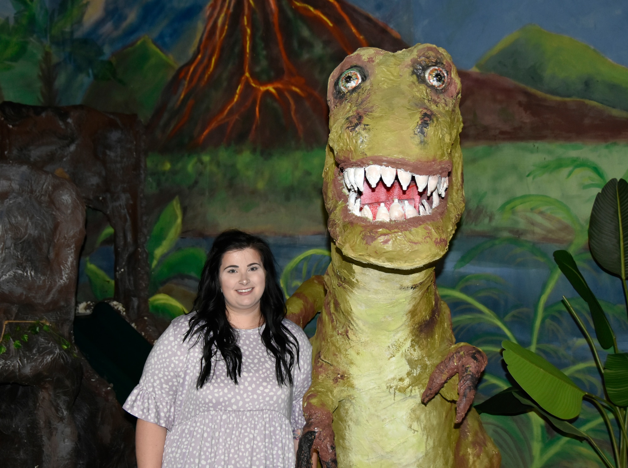Julia Burgett and a “friend” pose for a photo in the “Dino Tots” exhibit at the Hands-On Science Center in Tullahoma, Tennessee, Sept. 29, 2022. Burgett began her role as STEM coordinator for Arnold Air Force Base in mid-August. STEM stands for science, technology, engineering and math. She is tasked with executing the existing Arnold AFB STEM and growing the program through promotion in the community. (U.S. Air Force photo by Bradley Hicks)