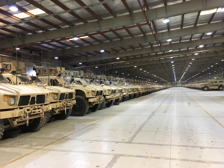 Hundreds of MRAPs, configured with theatre specific equipment, await issue from MAP-K’s climate controlled storage facility north of Camp Arifjan, Kuwait, July 30, 2019.