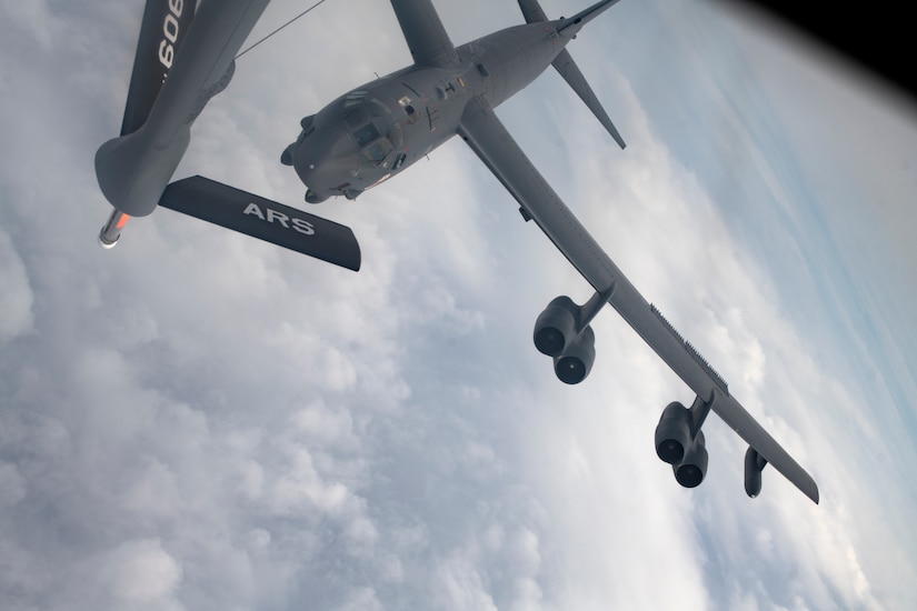 A plane is refueled in midair.