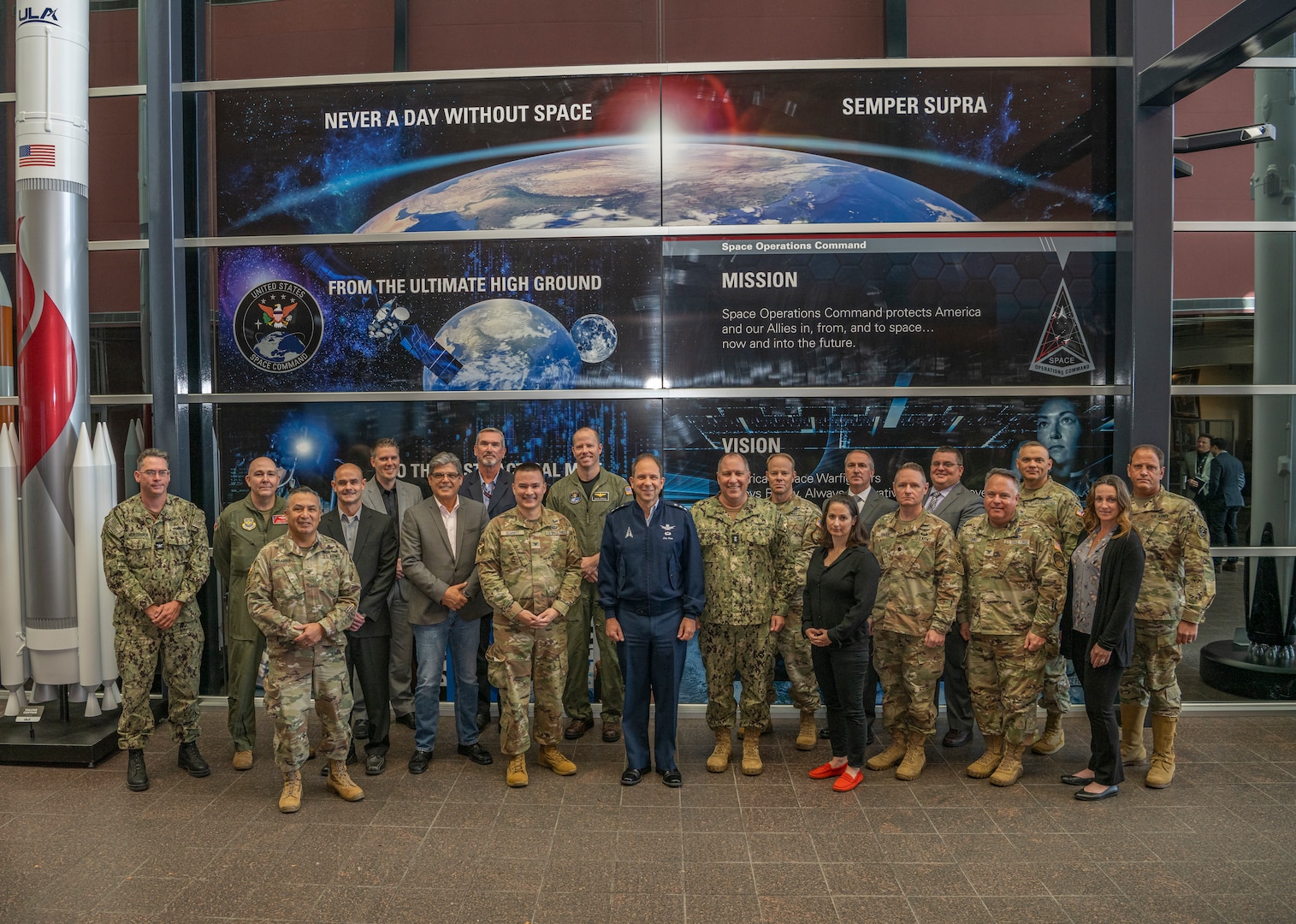 U.S. Space Force Lt. Gen. John Shaw, U.S. Space Command deputy and Rear Adm. William Pennington poses for a group photo with members from USSPACECOM's Joint Integrated Space Teams during  semi-annual conference at Peterson Space Force Base, Colo., Oct. 25-28, 2022.