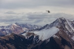 An LUH-72 Lakota helicopter is flown above mountainous terrain near Gypsum, Colorado, home of the Colorado National Guard's High-altitude Army National Guard Aviation Training Site, or HAATS, Oct. 16, 2022. Army Gen. Daniel Hokanson, chief, National Guard Bureau, visited HAATS to gain a full scope of the mission and training environment.