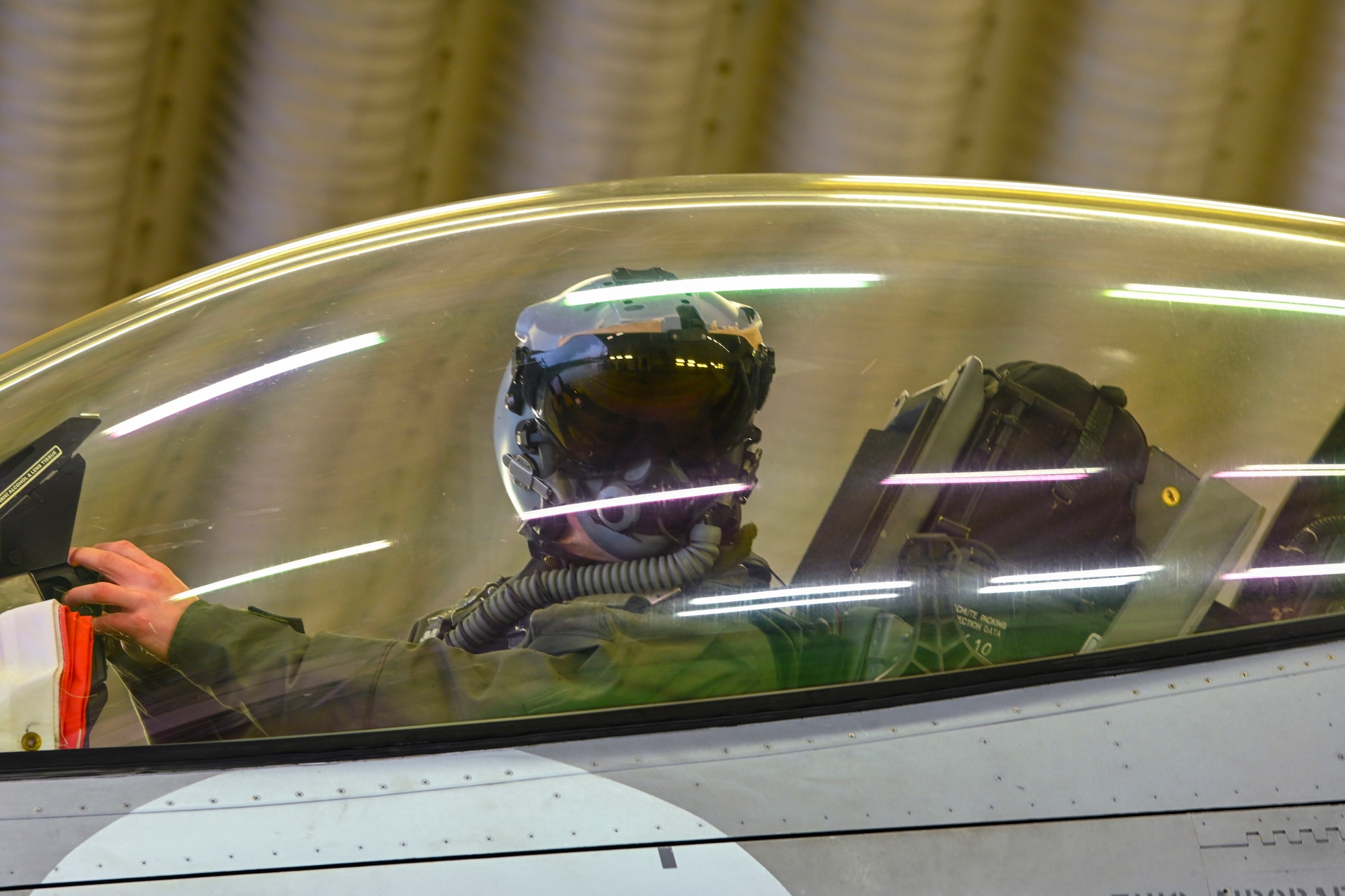 Pilot shown in F-16 with canopy down