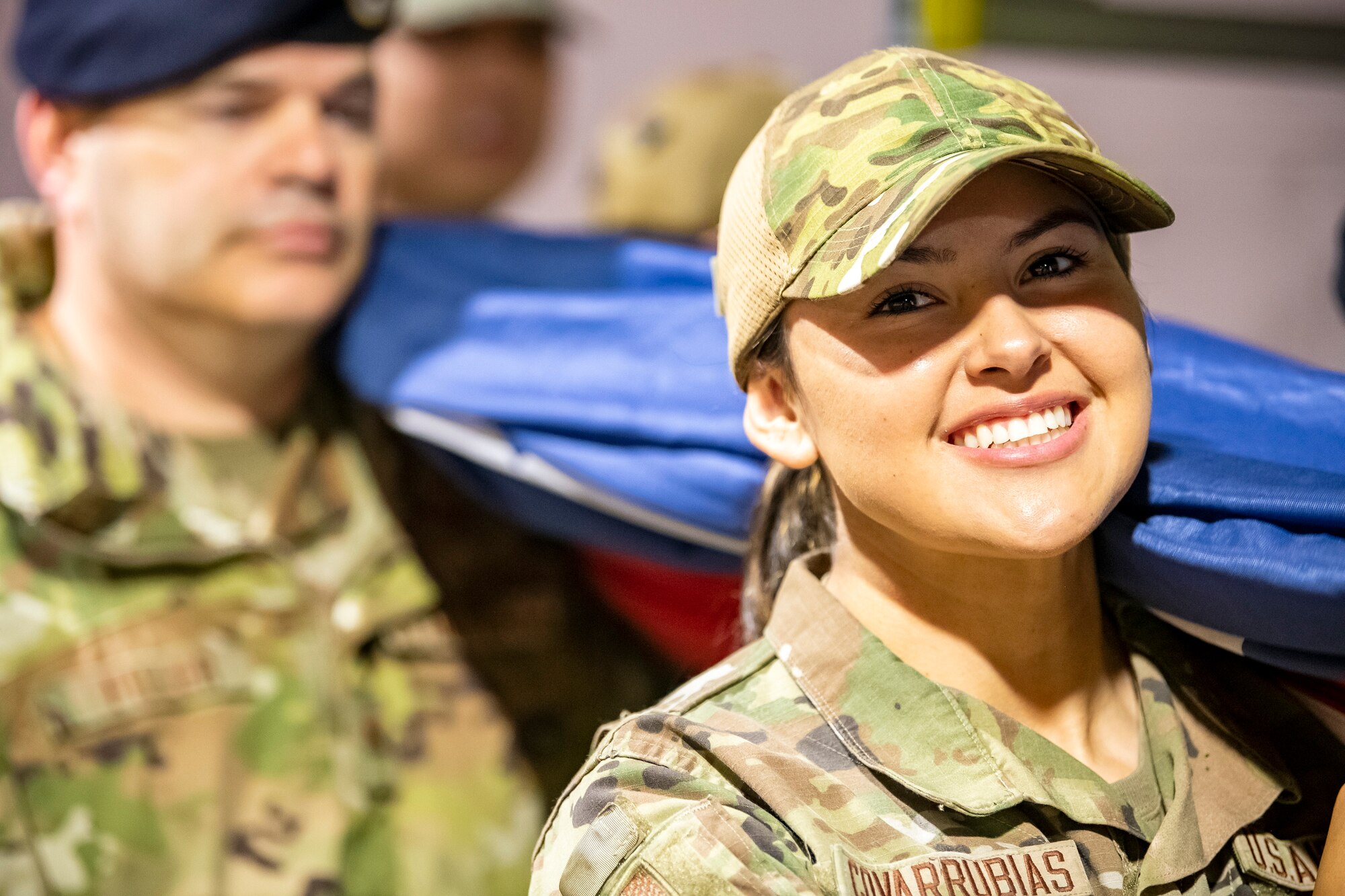 U.S. Air Force Airman 1st Class Leonela Covarrubias, 422d Security Forces Squadron flight member, holds an American flag prior to the national anthem at Wembley Stadium, in London, England, Oct. 30, 2022. Approximately 70 uniformed personnel represented the U.S. Air Force and nation by unveiling an American flag during the pre-game ceremonies of the Jacksonville Jaguars and Denver Broncos NFL game. (U.S. Air Force photo by Staff Sgt. Eugene Oliver)