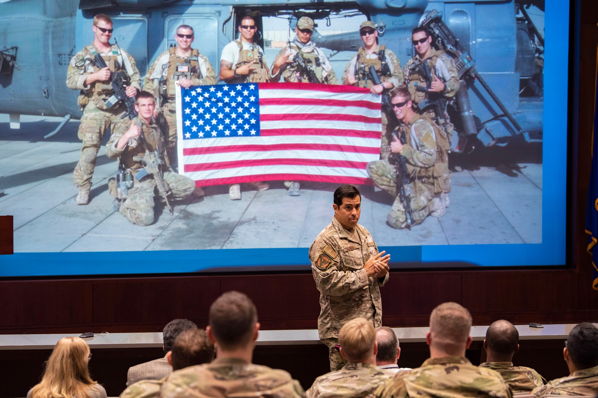 Tech. Sgt. August O’Niell, an Air Force Pararescueman, speaks to a crowd of Airmen from the Air Force Technical Applications Center at Patrick Space Force Base Fla., Oct. 20,2022.  O’Niell described the ordeal he faced when his helicopter was attacked by insurgents in Afghanistan, leading to the amputation of his left leg.  (U.S. Air Force photo by Matthew S. Jurgens)