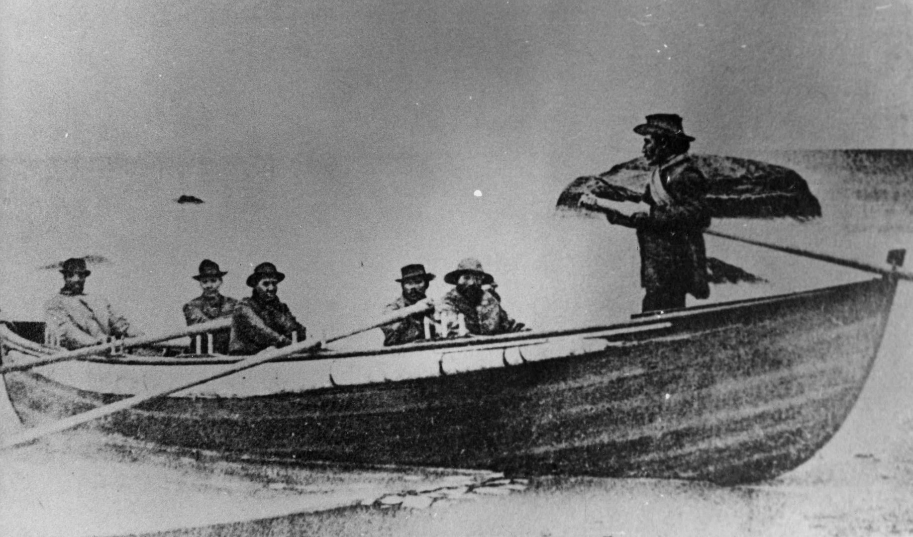 First boat used by Aquinnah Wampanoag rescuers, photographed after the event. Samuel Anthony is seated third from right. (Courtesy of the Martha’s Vineyard Museum)