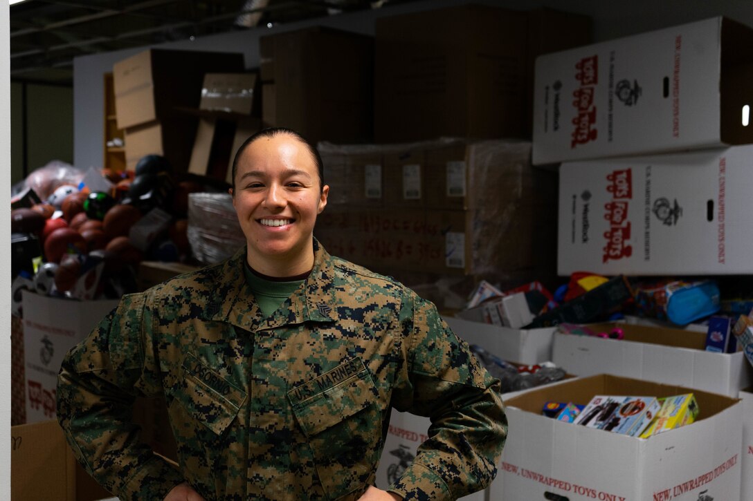 U.S. Marine Corps Sgt. Cristin Osornio, the supply chief for Bravo Company, 4th Law Enforcement Battalion, Force Headquarters Group, poses for a photo in the temporary warehouse for Toys for Tots in Pittsburgh, Dec. 4, 2021. Osornio is in charge of the Toys for Tots program for North Versailles and Southwestern Pittsburgh. (U.S. Marine Corps photo by Cpl. Gavin Umboh)