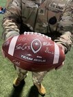 Liberty High School debuts the Virginia Army National Guard’s new football jerseys Oct. 28, 2022, at a home game against John Handley High School in Bealeton, Virginia. Staff Sgt. Dakota Baughan, area Virginia Army National Guard recruiter and a graduate of Liberty High School, secured the jerseys for Liberty’s use at their military appreciation game. (U.S. Army National Guard photo by Sgt. 1st Class Terra C. Gatti)