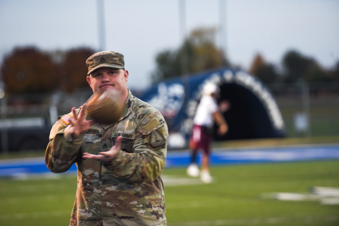 Liberty High School debuts the Virginia Army National Guard’s new football jerseys Oct. 28, 2022, at a home game against John Handley High School in Bealeton, Virginia. Staff Sgt. Dakota Baughan, area Virginia Army National Guard recruiter and a graduate of Liberty High School, secured the jerseys for Liberty’s use at their military appreciation game. (U.S. Army National Guard photo by Sgt. 1st Class Terra C. Gatti)