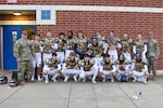 Liberty High School debuts the Virginia Army National Guard’s new football jerseys Oct. 28, 2022, at a home game against John Handley High School in Bealeton, Virginia. Staff Sgt. Dakota Baughan, area Virginia Army National Guard recruiter and a graduate of Liberty High School, secured the jerseys for Liberty’s use at their military appreciation game. (U.S. Army National Guard photo by Sgt. 1st Class Terra C. Gatti)